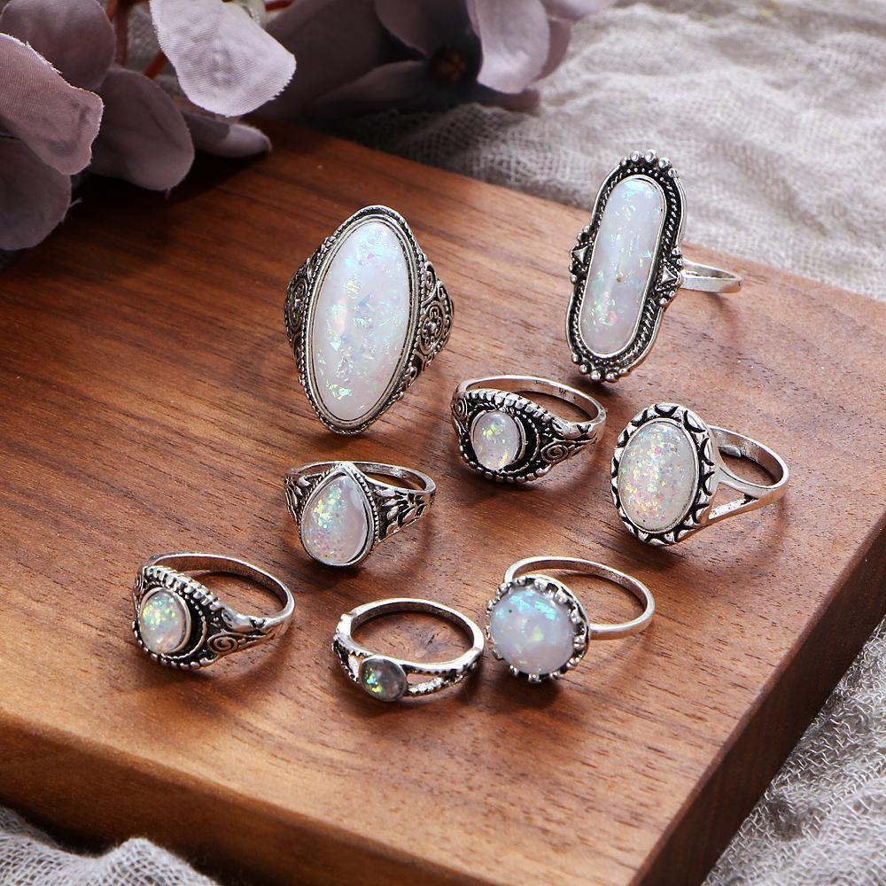 An elegant 8 piece ring set featuring opal created stones and Austrian crystals, beautifully oxidized for a timeless look.