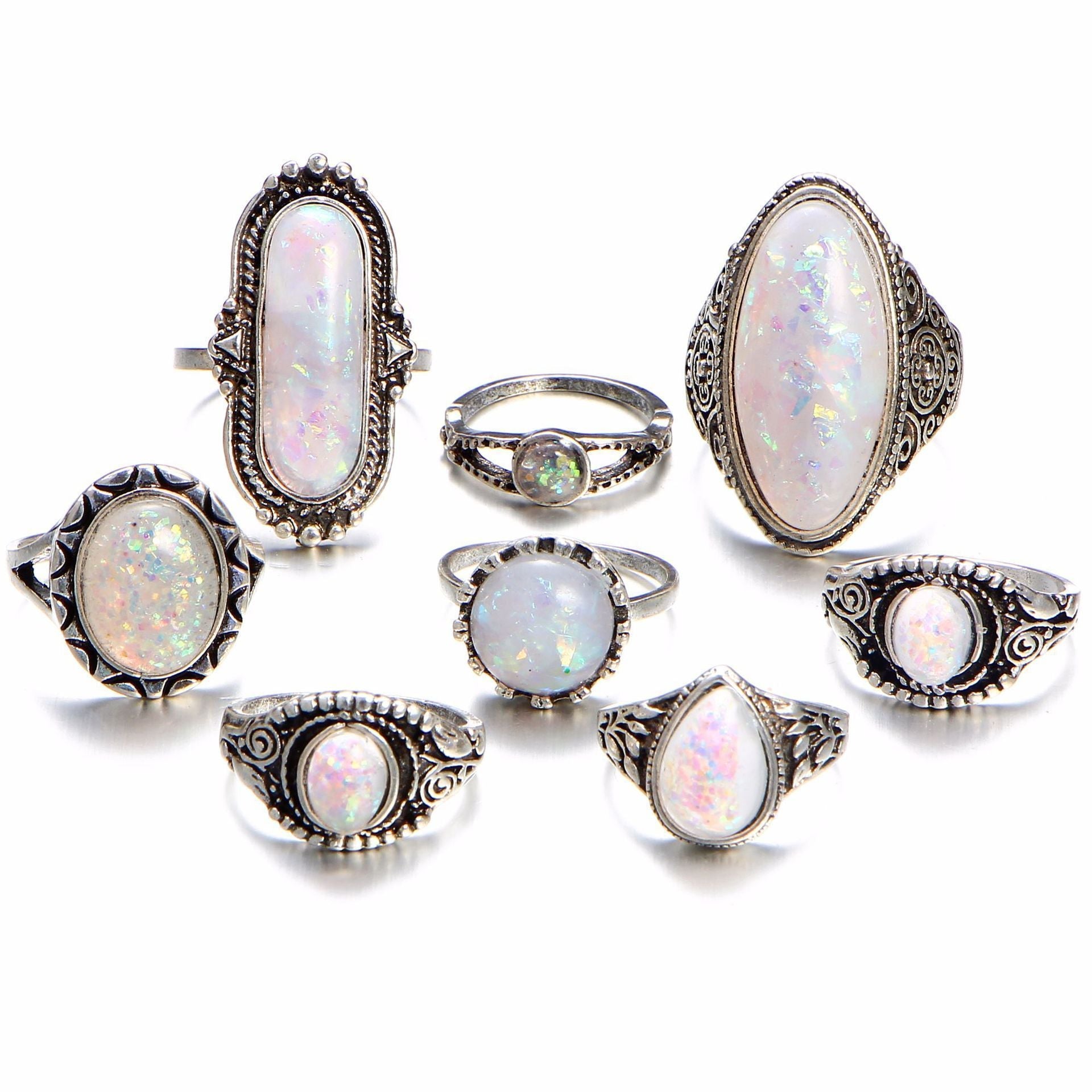 An elegant 8 piece ring set featuring opal created stones and Austrian crystals, beautifully oxidized for a timeless look.