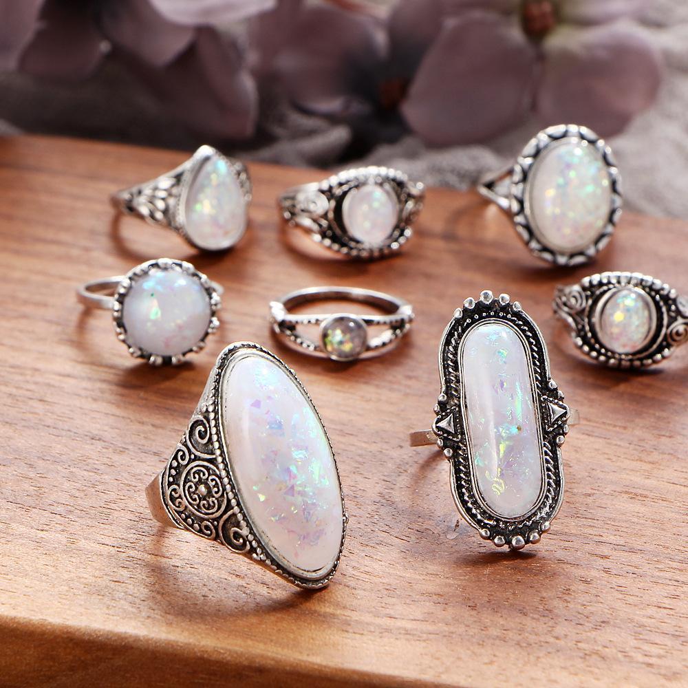 An elegant 8 piece ring set featuring opal created stones and Austrian crystals, beautifully oxidized for a timeless look.