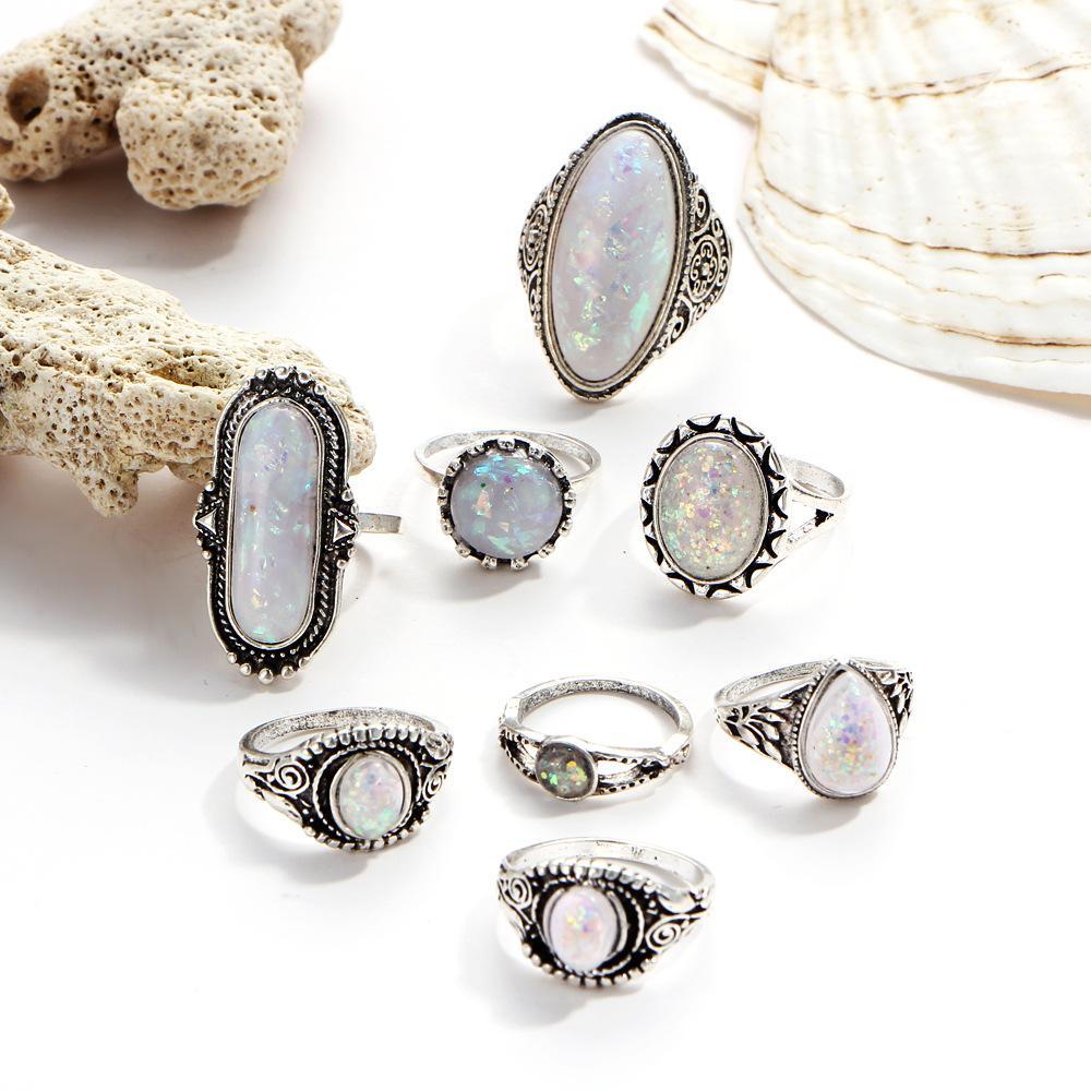 An elegant 8 piece ring set featuring opal created stones and Austrian crystals, beautifully oxidized for a timeless look.