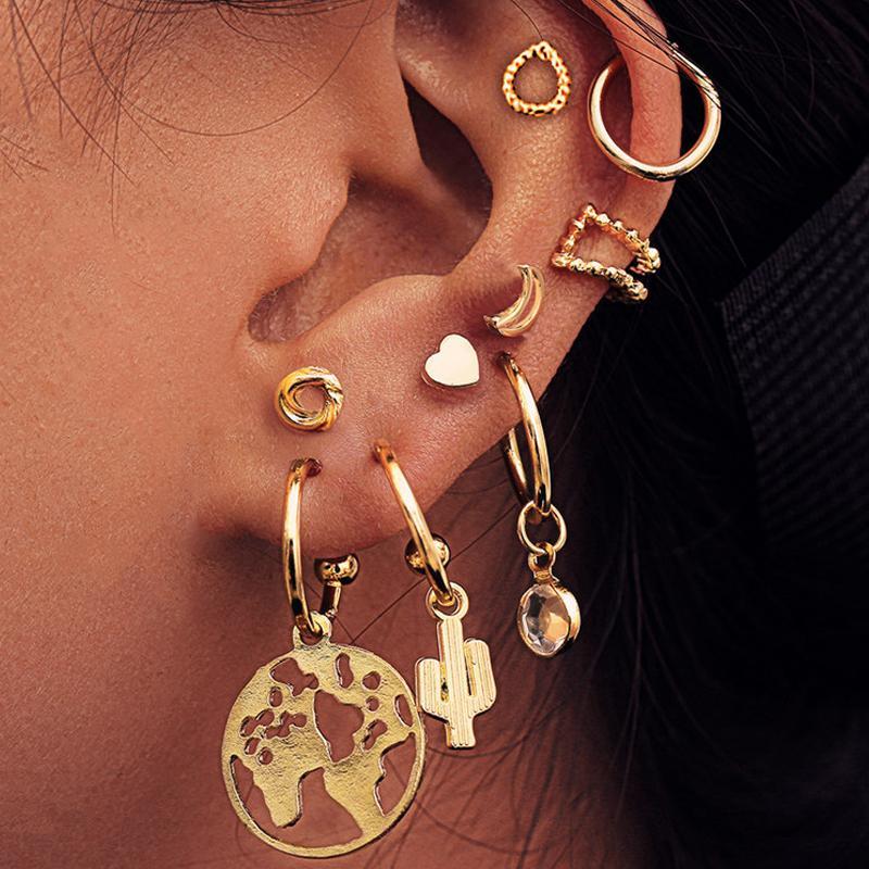 A beautiful 9 piece earring set featuring various styles, all crafted in 18K gold plating, showcasing Italian craftsmanship.