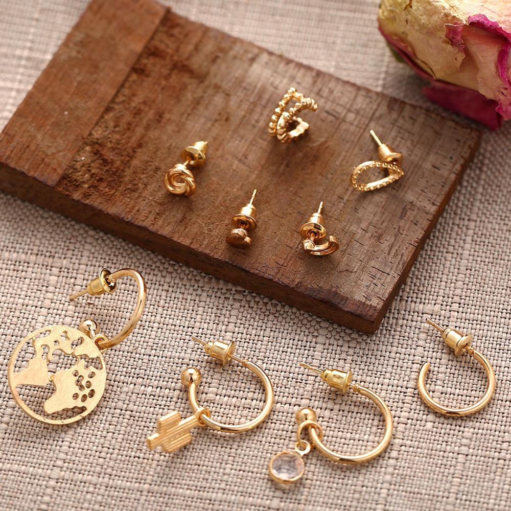 A beautiful 9 piece earring set featuring various styles, all crafted in 18K gold plating, showcasing Italian craftsmanship.