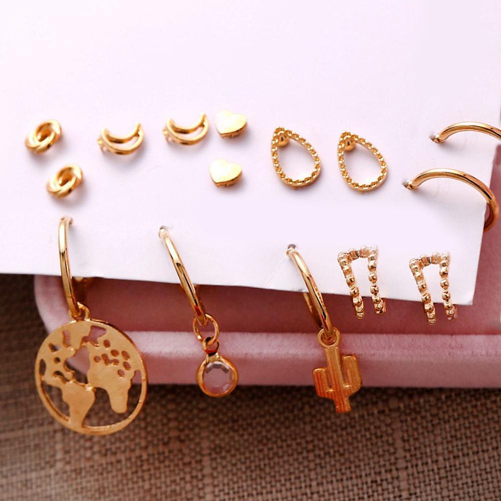 A beautiful 9 piece earring set featuring various styles, all crafted in 18K gold plating, showcasing Italian craftsmanship.