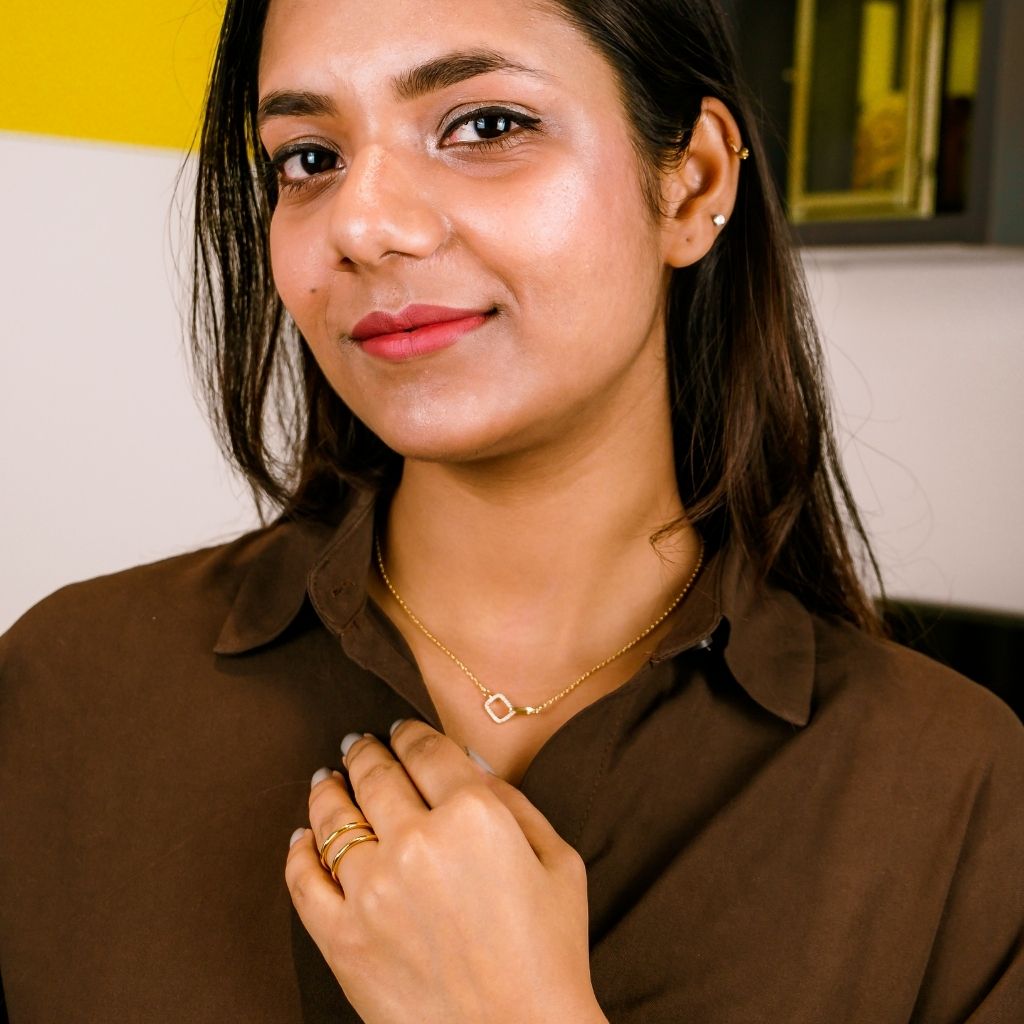 925 Silver Square Interlocking Zircon Necklace featuring a geometric design with embedded zircon gemstones, displayed elegantly on a soft background.