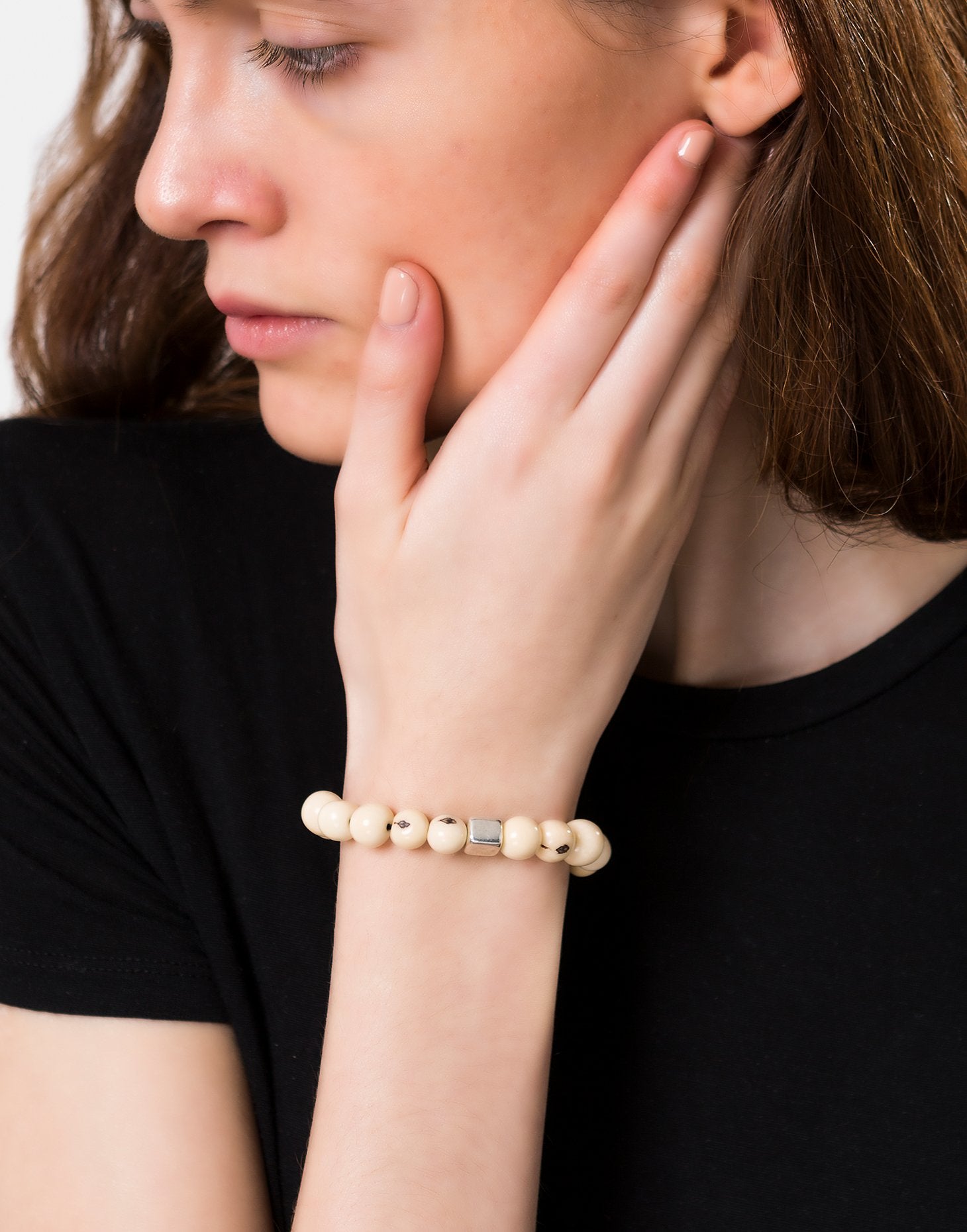 A collection of vibrant Acai Berry Bracelets featuring cool colours, silver plated cubes, and elasticated bands, showcasing their unique design.