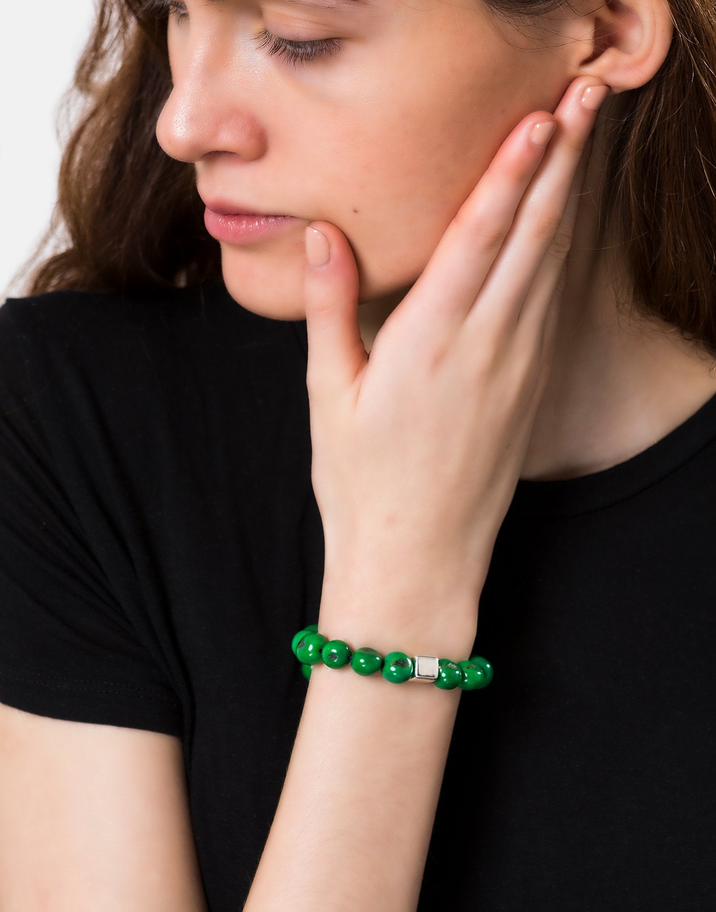 A collection of vibrant Acai Berry Bracelets featuring cool colours, silver plated cubes, and elasticated bands, showcasing their unique design.