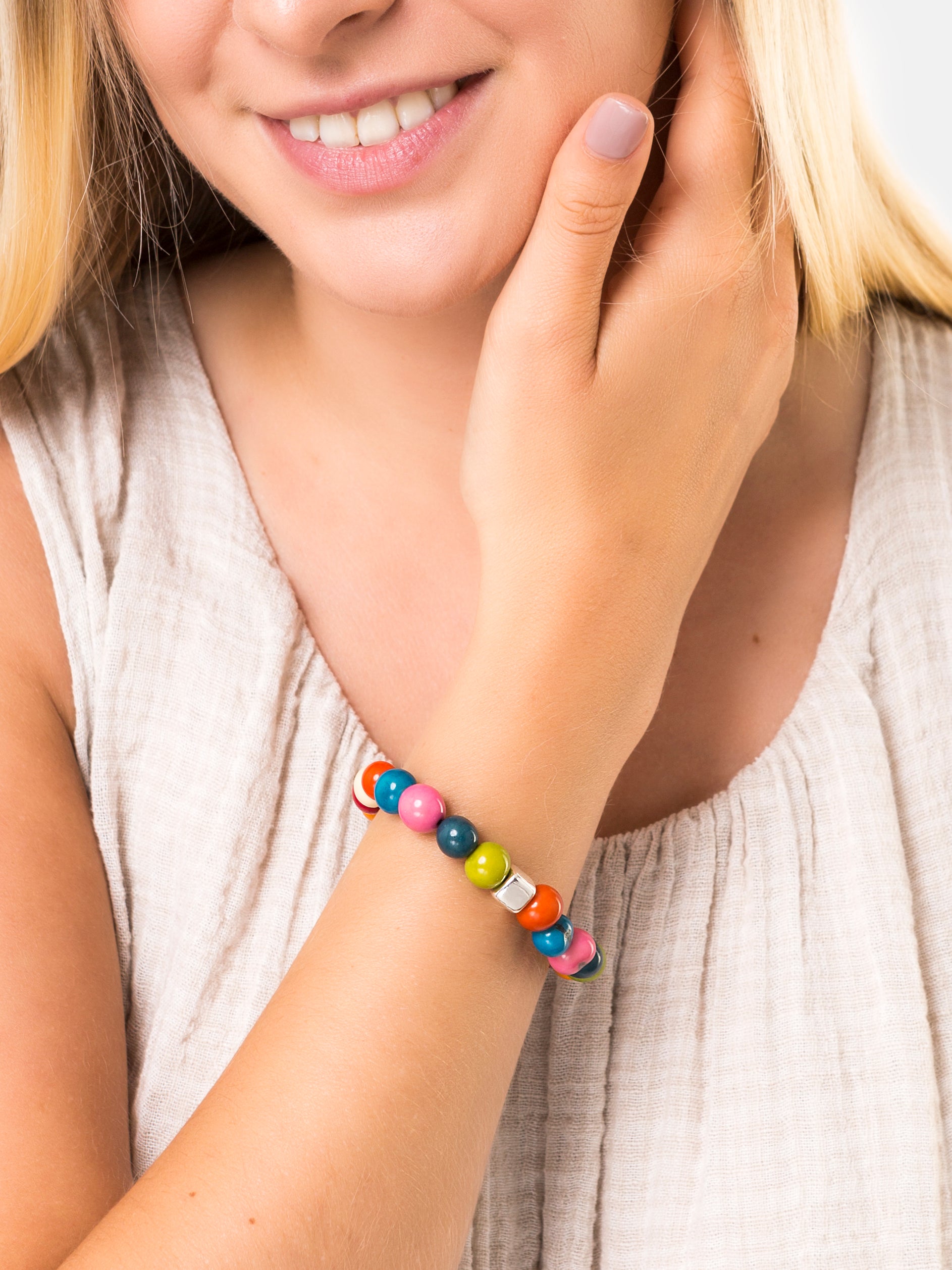 Multicoloured Acai Berry Bracelet featuring organic seeds and silver plated cube, showcasing its unique design and eco-friendly materials.