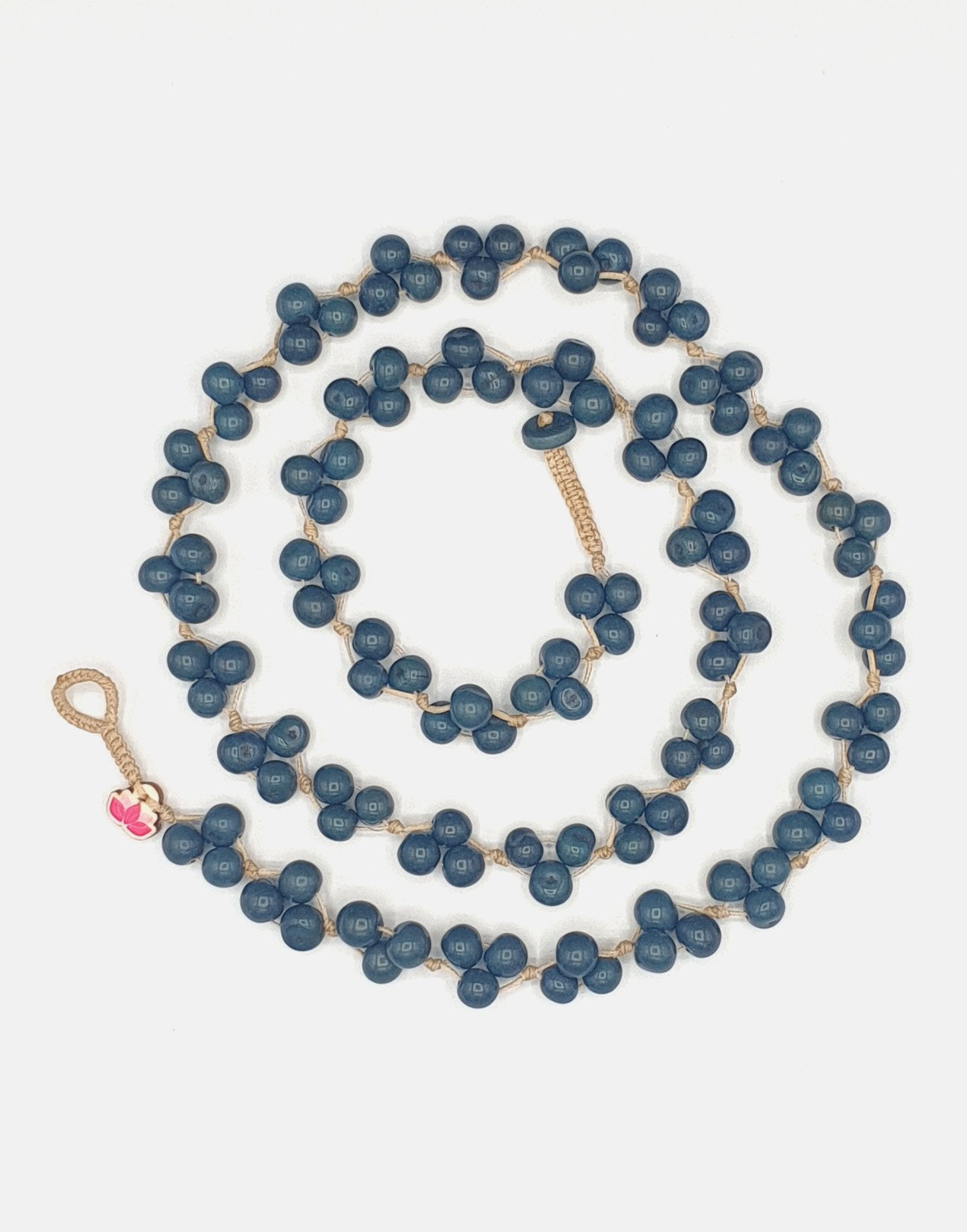 A vibrant Acai Berry Long Necklace made from colorful acai seeds, showcasing its lightweight and handmade design.