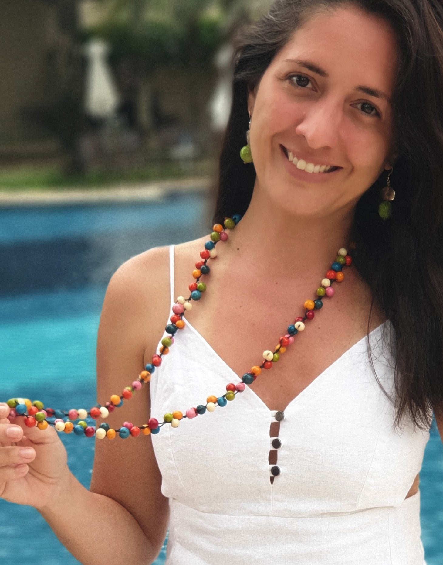 A vibrant Acai Berry Long Necklace featuring multicoloured acai seeds, showcasing its lightweight and handmade design.