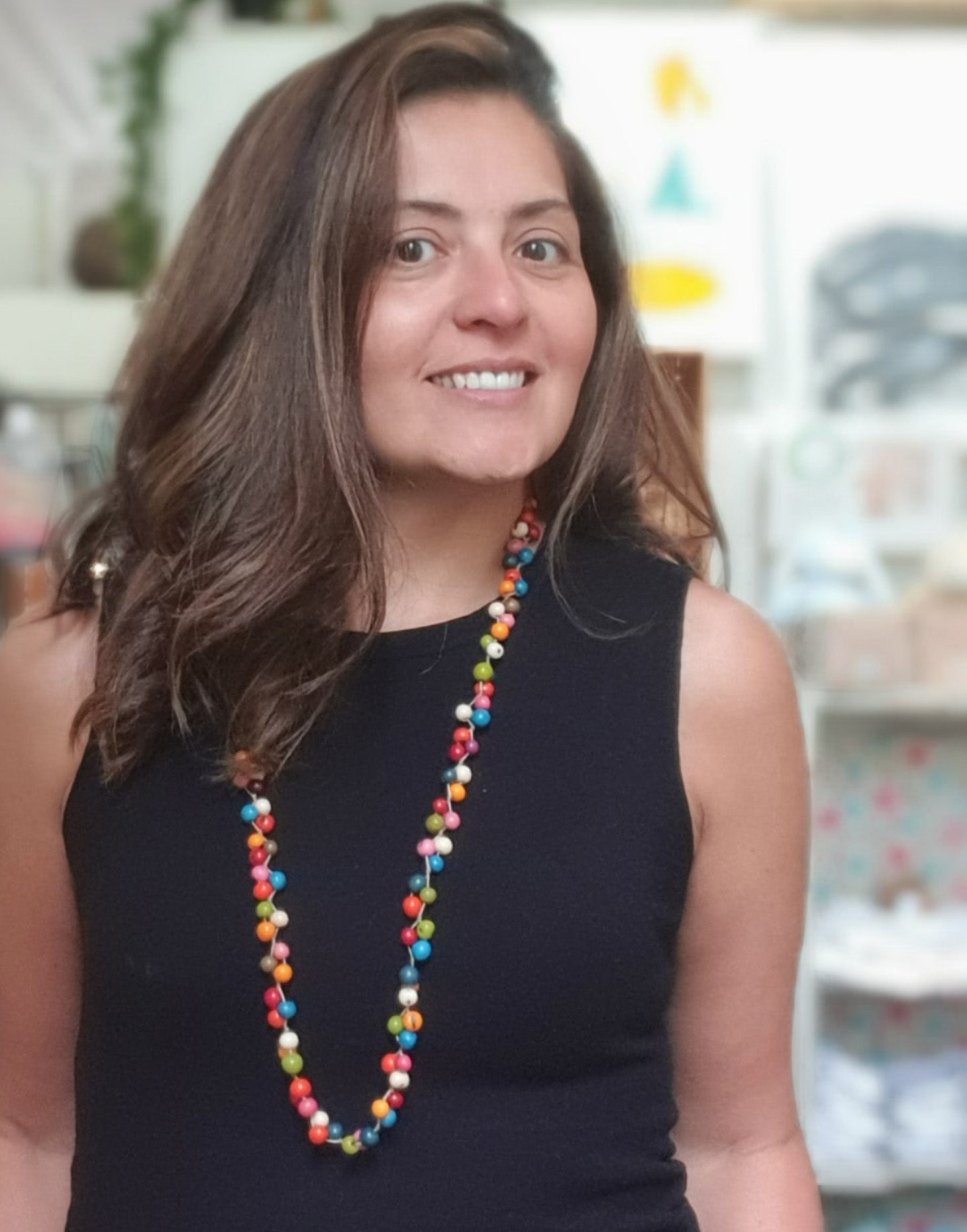 A vibrant Acai Berry Long Necklace featuring multicoloured acai seeds, showcasing its lightweight and handmade design.