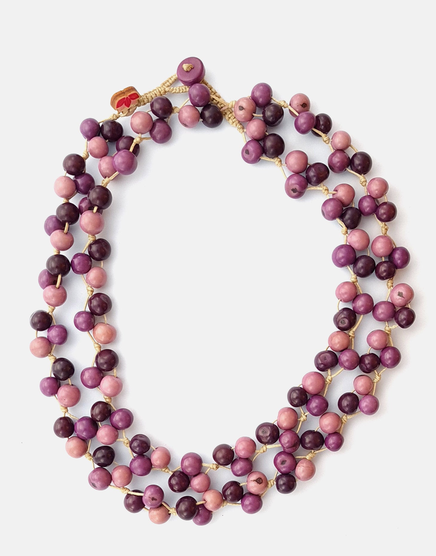 Acai Berry Long Necklace featuring warm colours, handmade with organic acai seeds, showcasing a lightweight and delicate design.