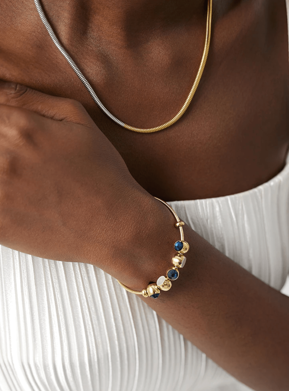 Adina two tone gold chain featuring rich gold and silver tones, adjustable length, and elegant design, perfect for layering or standalone wear.