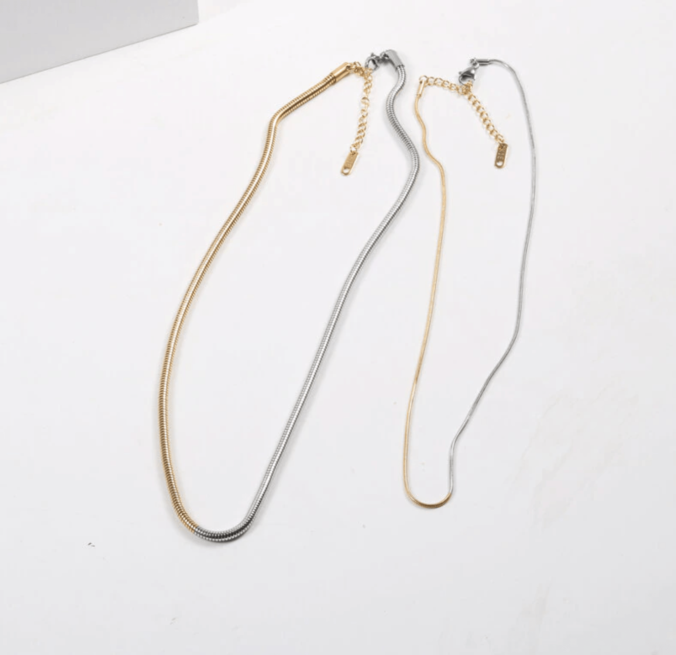 Adina two tone gold chain featuring rich gold and silver tones, adjustable length, and elegant design, perfect for layering or standalone wear.