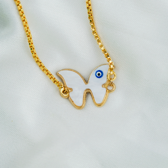 Adjustable Butterfly Evil Eye Bracelet featuring a white butterfly charm and blue evil eye on a gold chain, symbolizing protection and transformation.