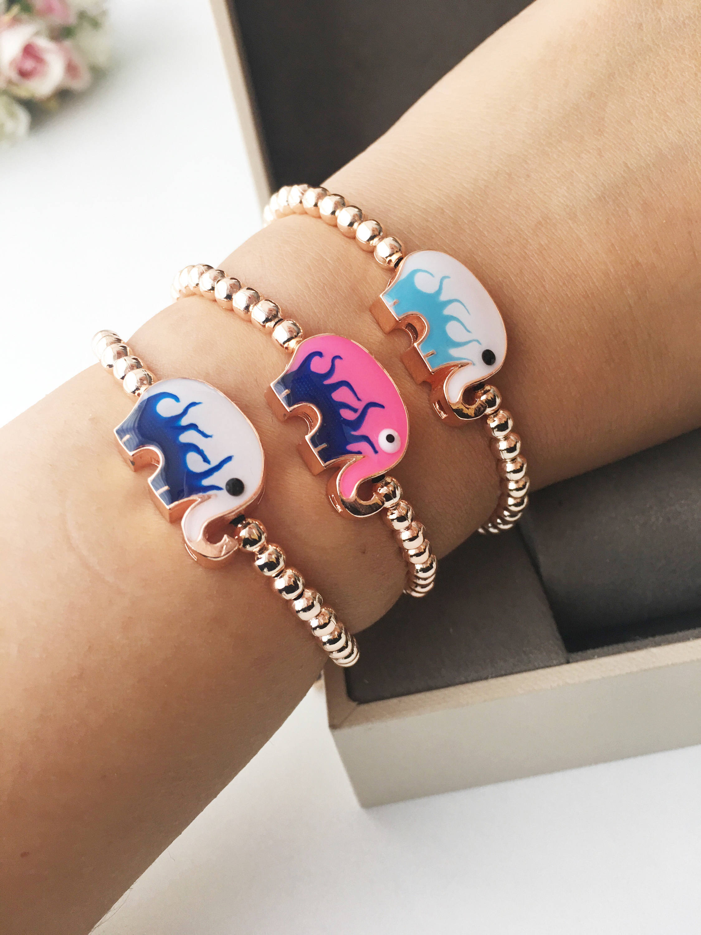 Adjustable Elephant Charm Bracelet featuring colorful elephant charms and rose gold beads, showcasing a stylish and meaningful design.