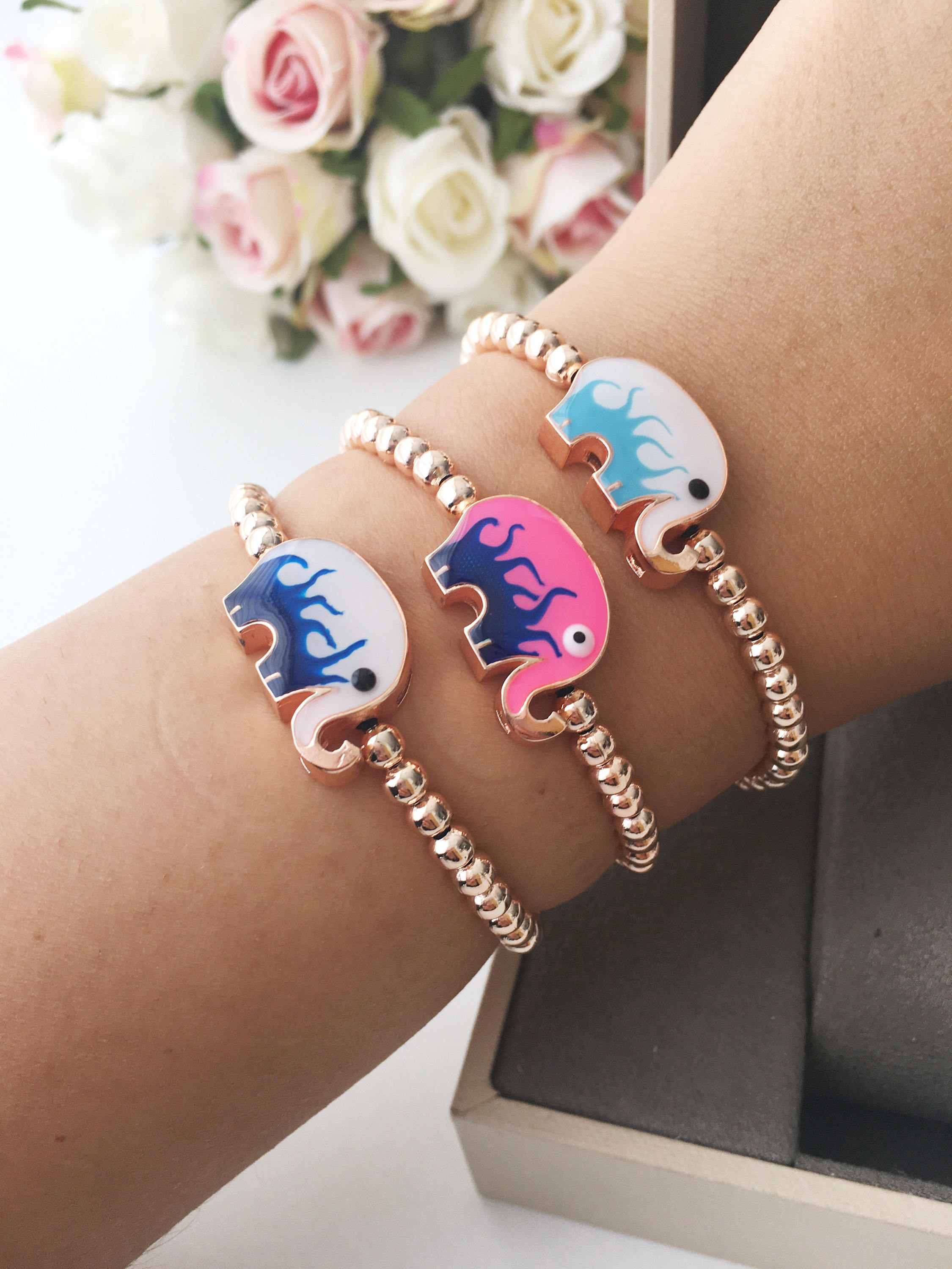 Adjustable Elephant Charm Bracelet featuring colorful elephant charms and rose gold beads, showcasing a stylish and meaningful design.