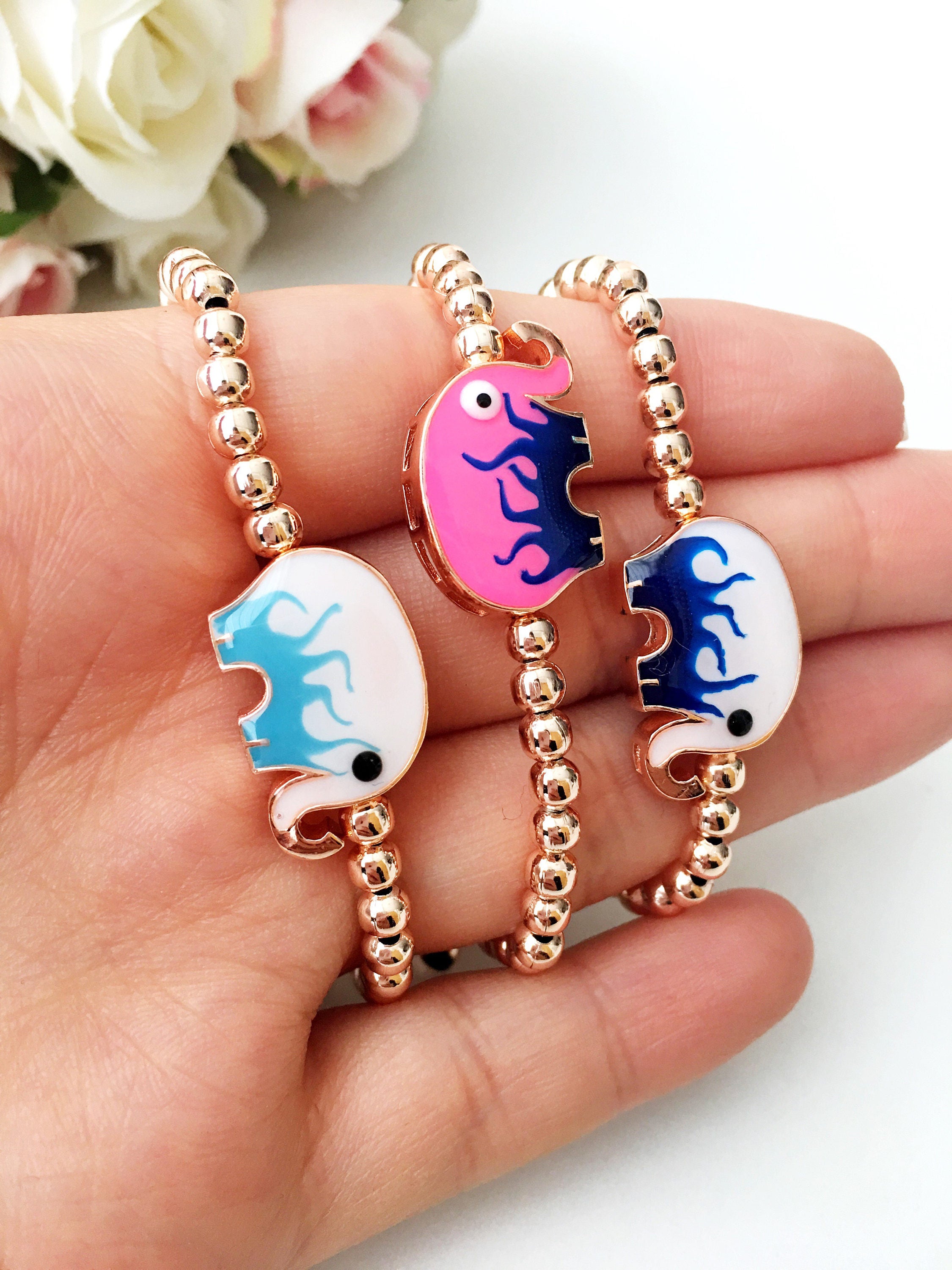 Adjustable Elephant Charm Bracelet featuring colorful elephant charms and rose gold beads, showcasing a stylish and meaningful design.