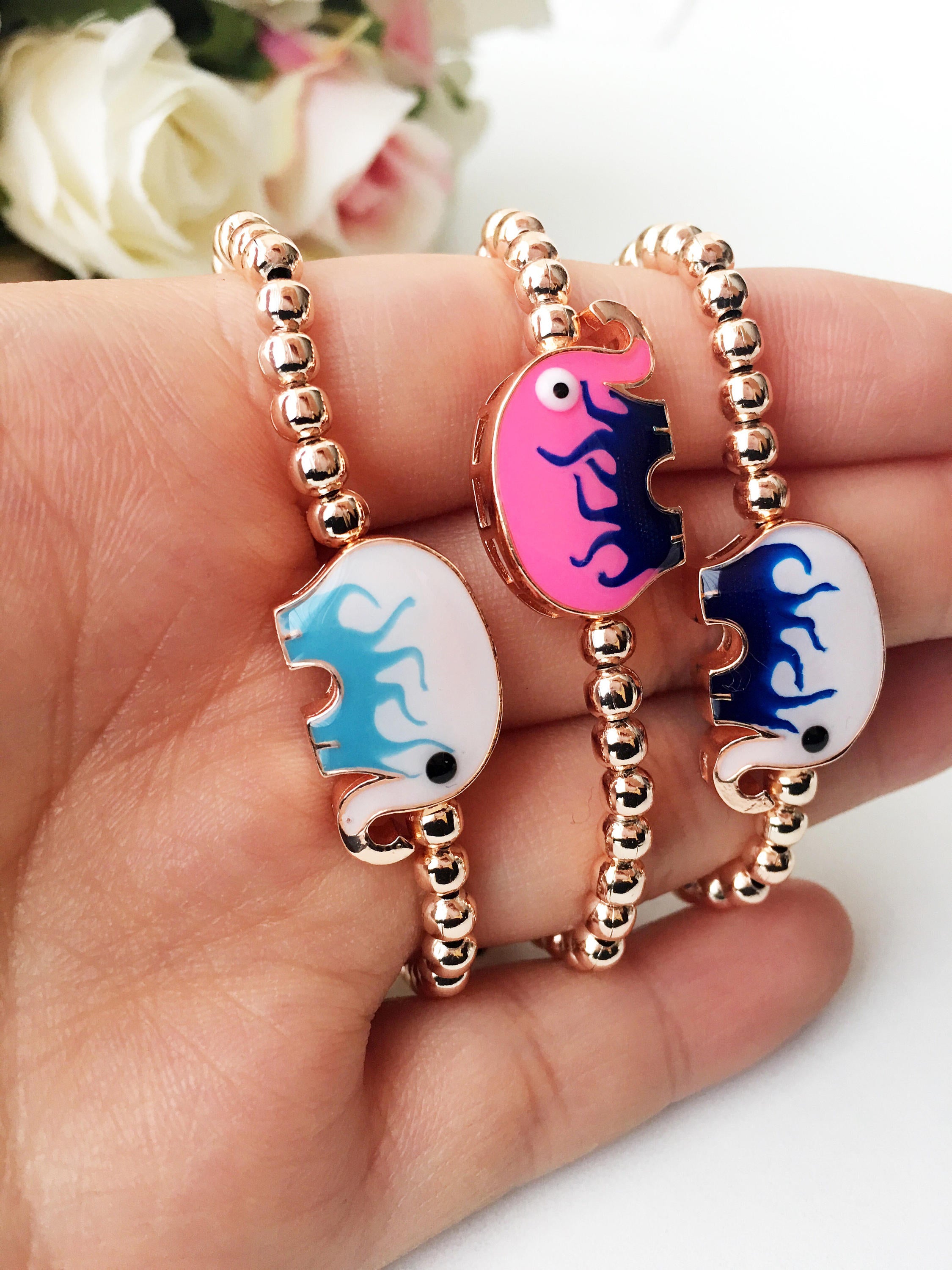 Adjustable Elephant Charm Bracelet featuring colorful elephant charms and rose gold beads, showcasing a stylish and meaningful design.