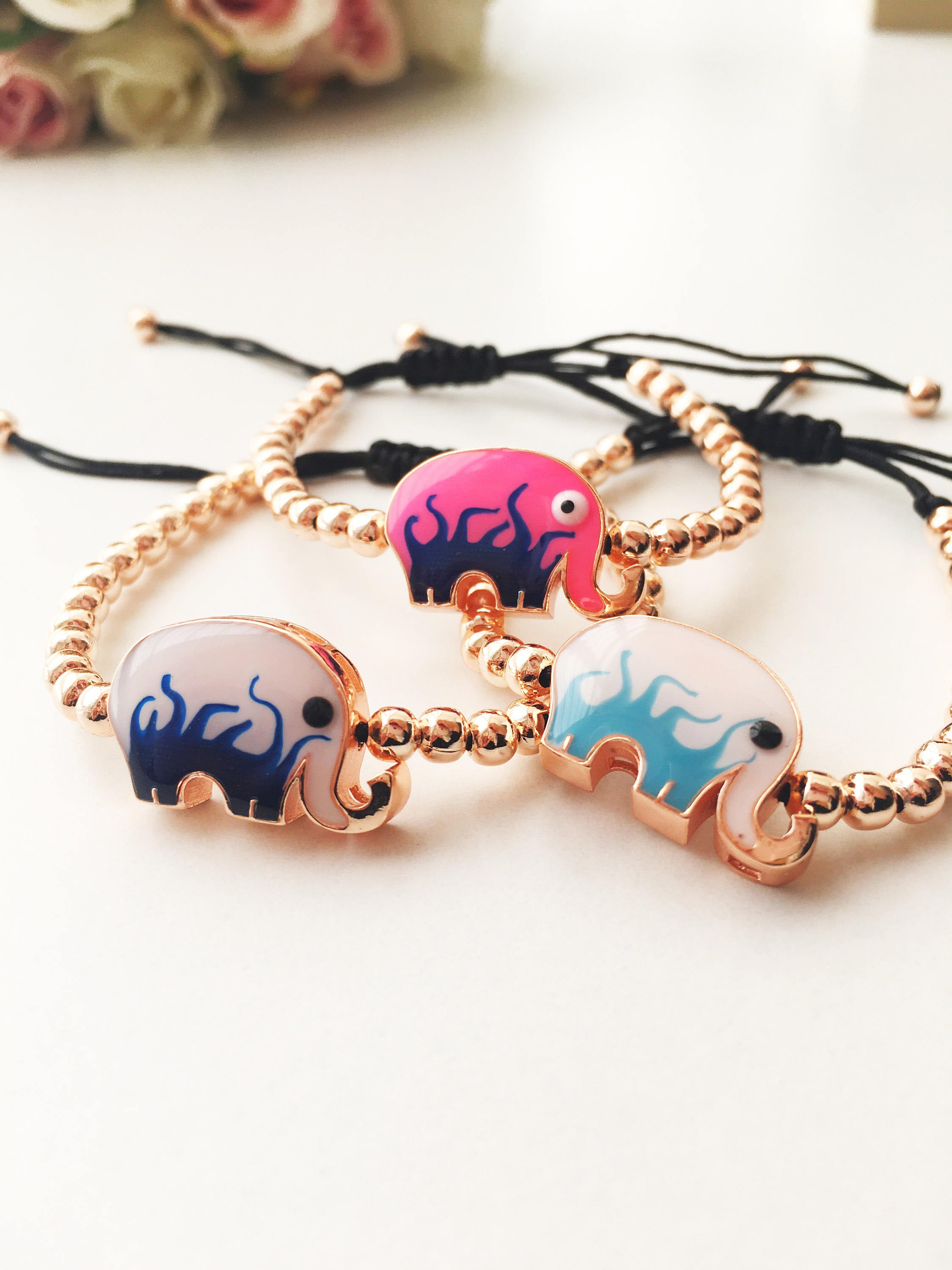 Adjustable Elephant Charm Bracelet featuring colorful elephant charms and rose gold beads, showcasing a stylish and meaningful design.