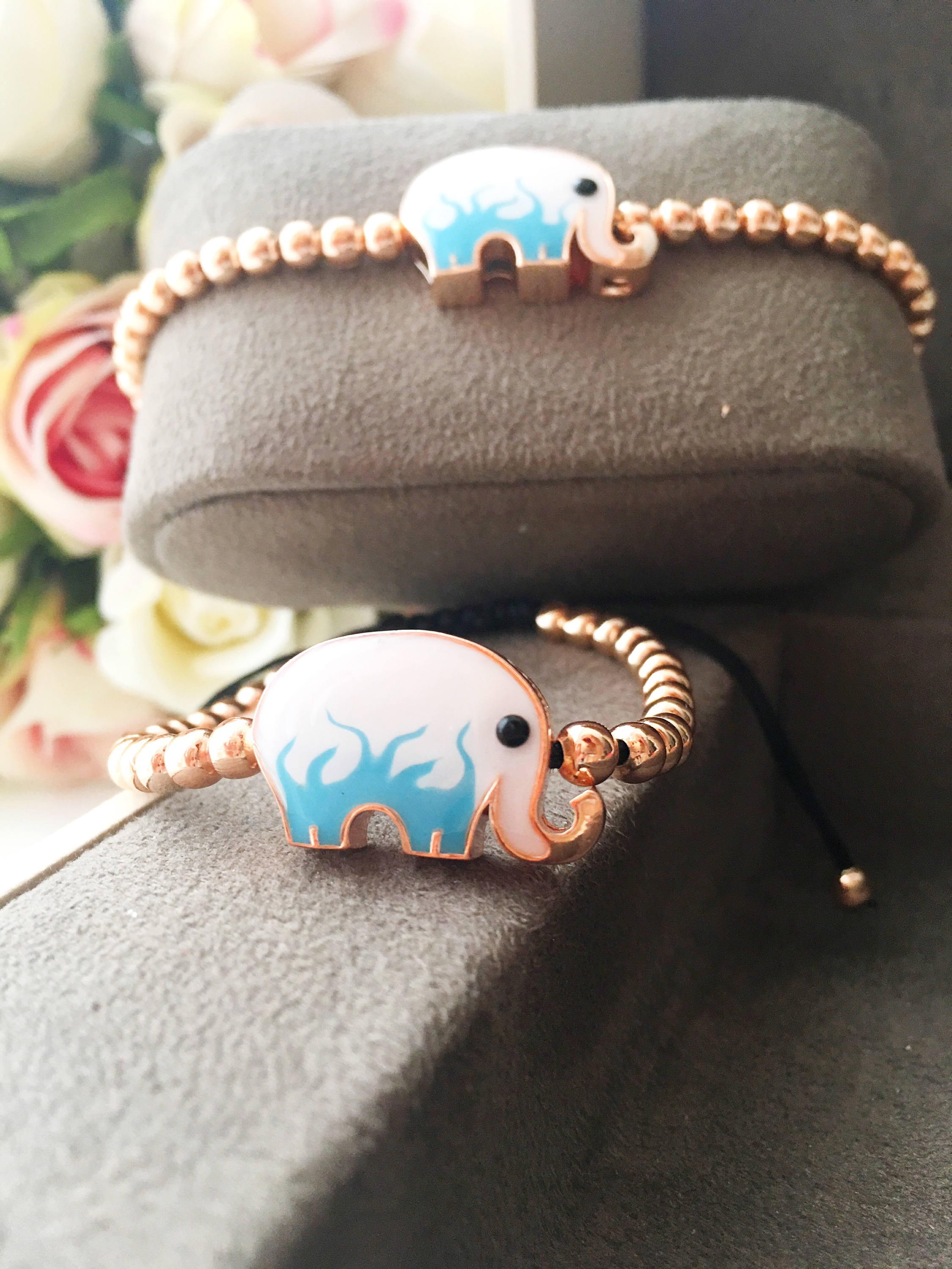 Adjustable Elephant Charm Bracelet featuring colorful elephant charms and rose gold beads, showcasing a stylish and meaningful design.