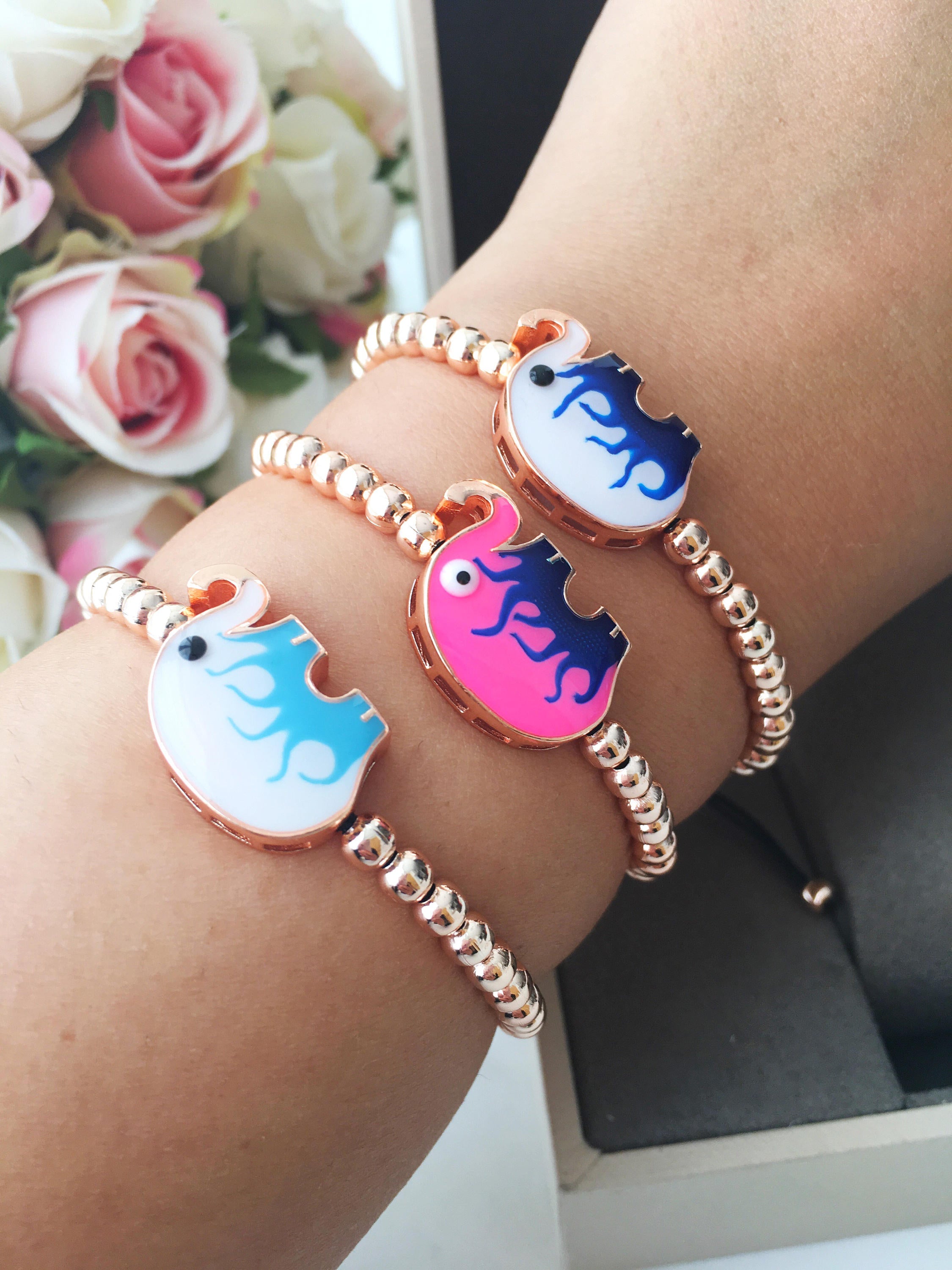 Adjustable Elephant Charm Bracelet featuring colorful elephant charms and rose gold beads, showcasing a stylish and meaningful design.