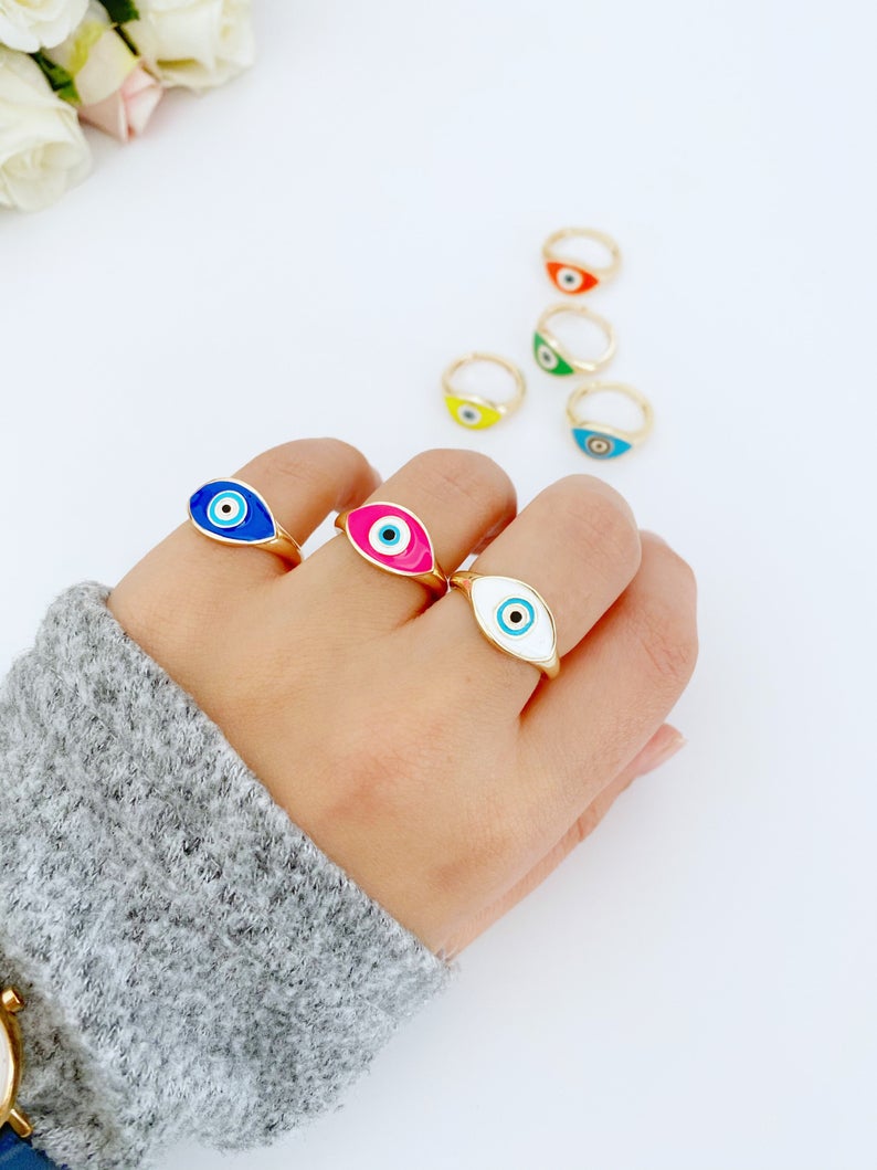 Adjustable Evil Eye Ring featuring a gold band and blue white evil eye bead, perfect for gifting and everyday wear.