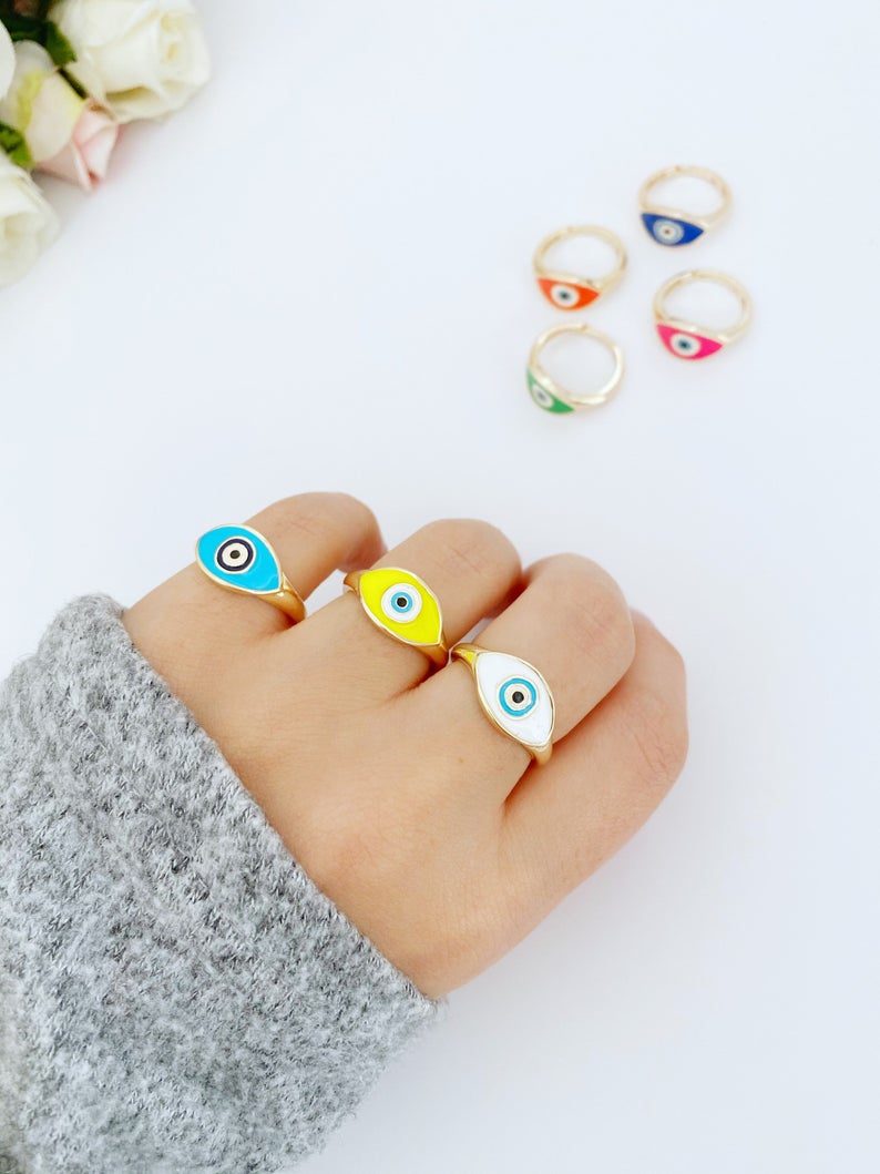 Adjustable Evil Eye Ring featuring a gold band and blue white evil eye bead, perfect for gifting and everyday wear.