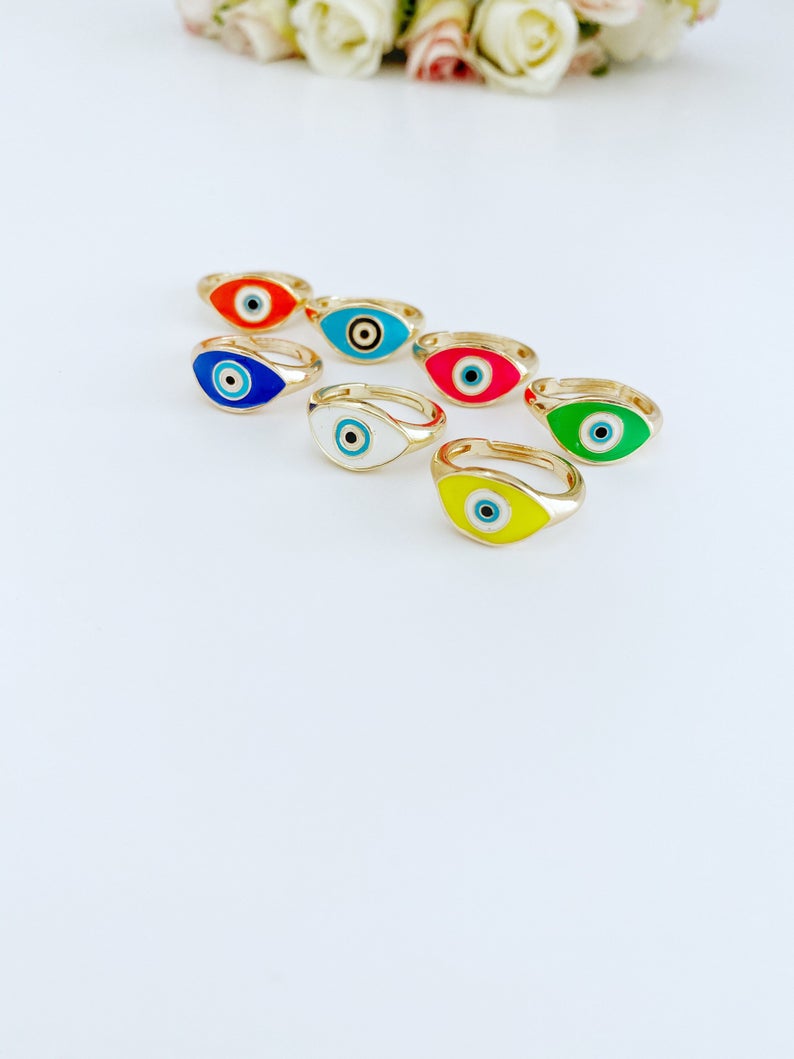 Adjustable Evil Eye Ring featuring a gold band and blue white evil eye bead, perfect for gifting and everyday wear.