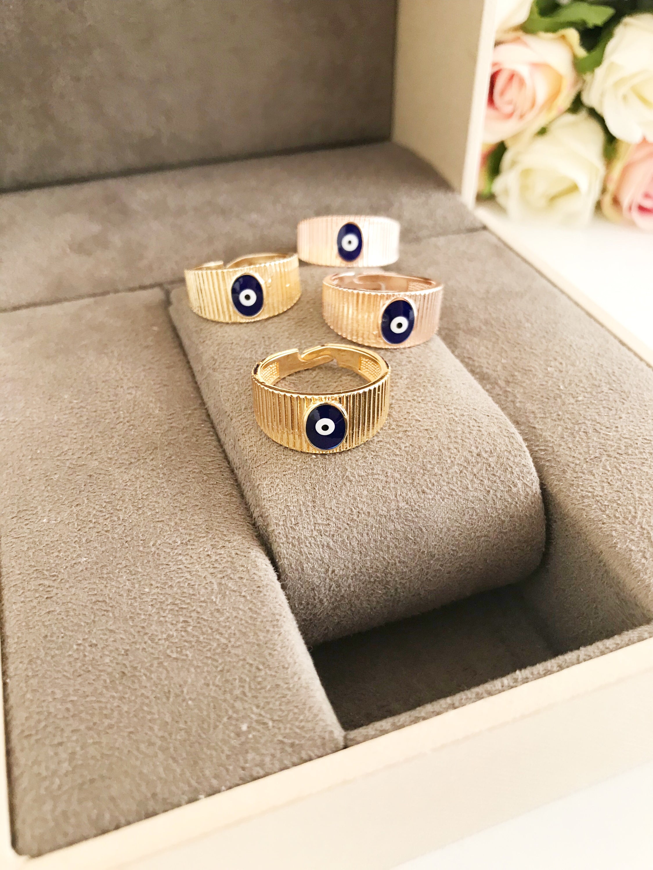 Adjustable Gold Evil Eye Ring featuring a gold band and colorful evil eye bead, symbolizing protection and style.