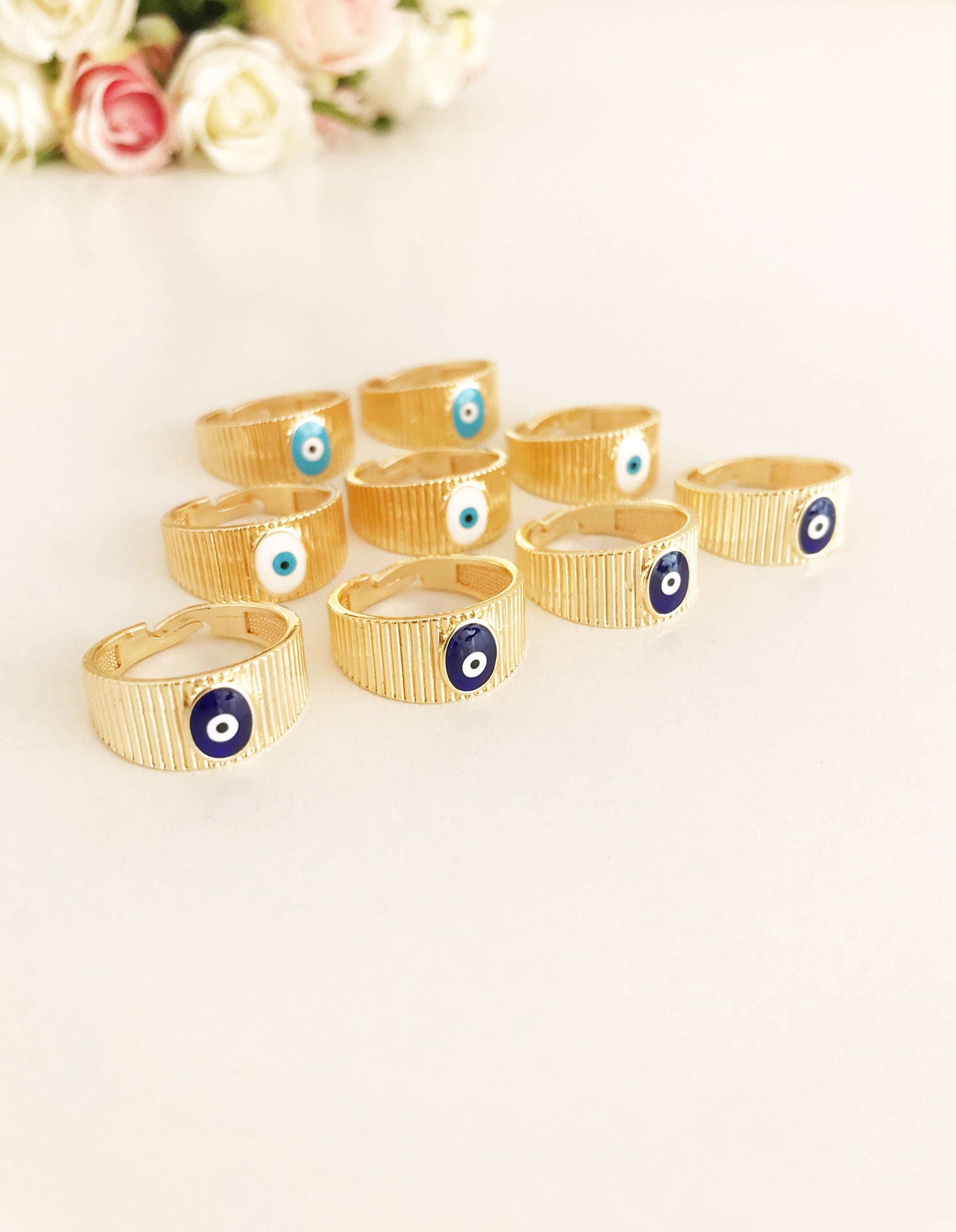 Adjustable Gold Evil Eye Ring featuring a gold band and colorful evil eye bead, symbolizing protection and style.