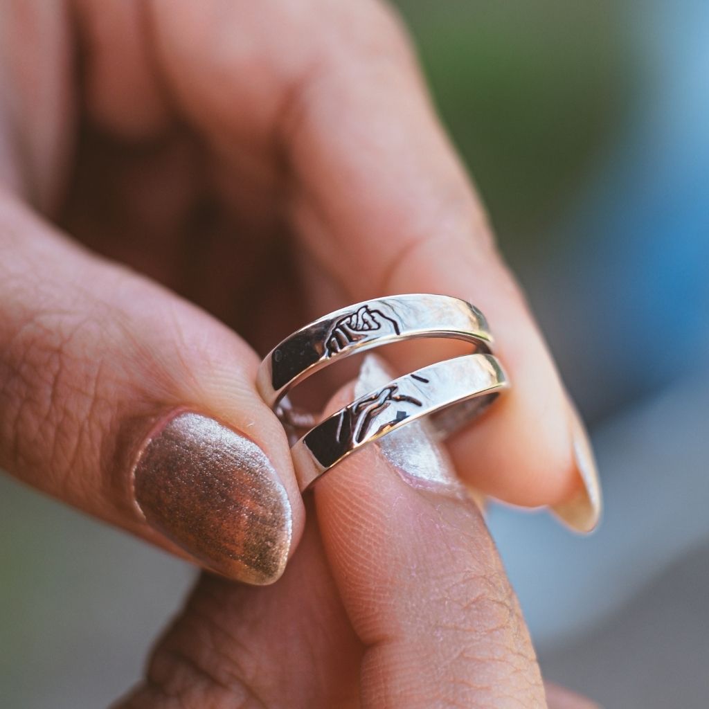 Adjustable Hand Holding Matching Couple Band Promise Ring Set in elegant silver, symbolizing love and unity for couples.