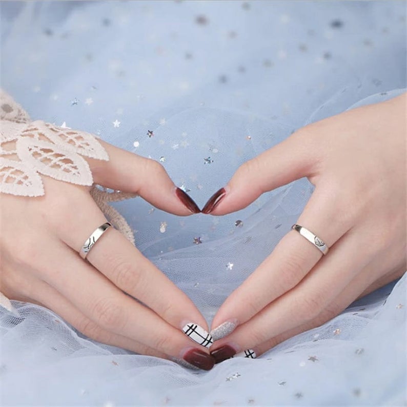 Adjustable Hand Holding Matching Couple Band Promise Ring Set in elegant silver, symbolizing love and unity for couples.