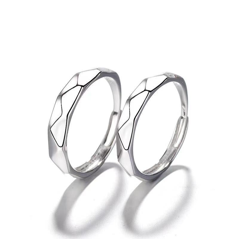 Adjustable couple open rings with hill edges design, crafted from alloy, showcasing a unique and meaningful symbol of love.