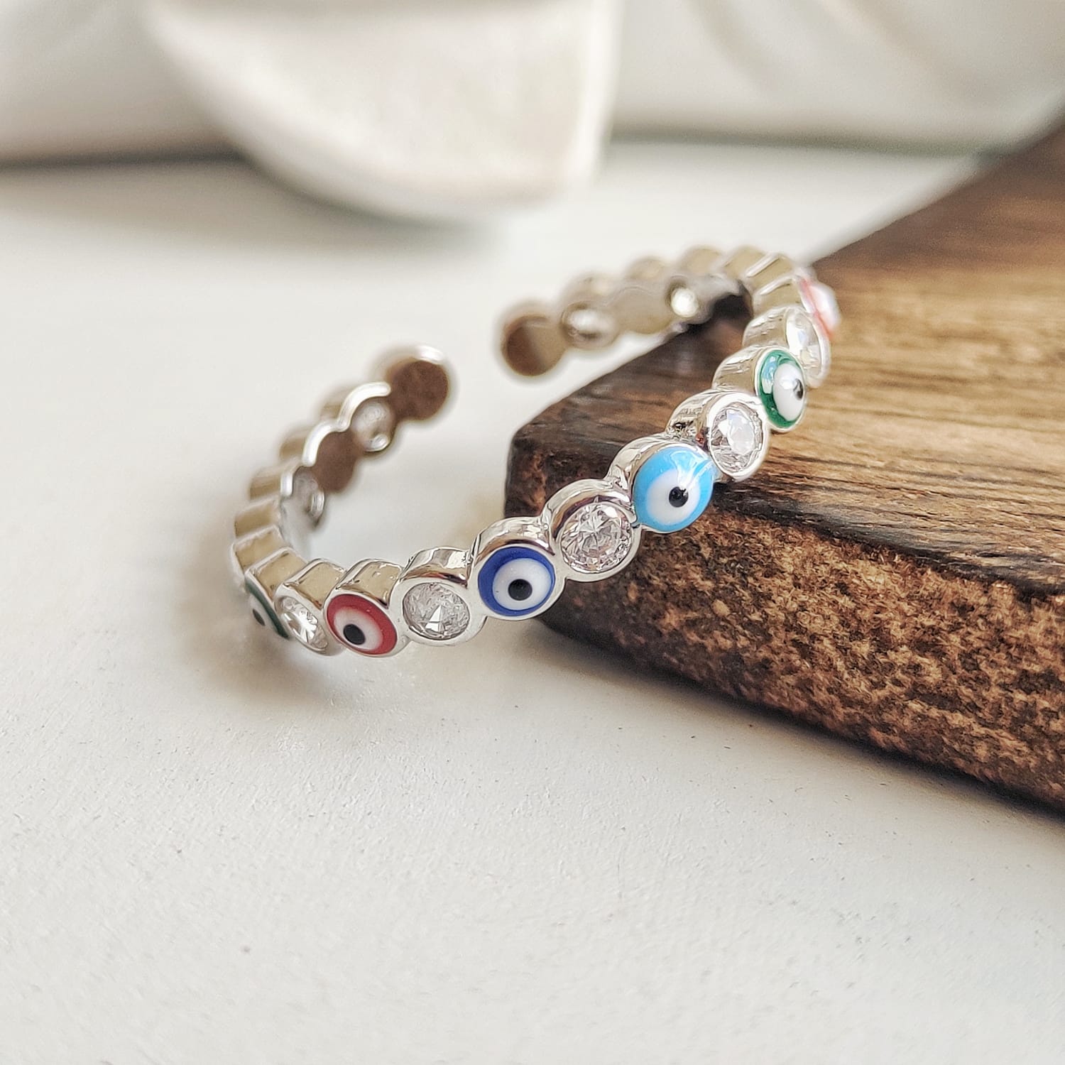 Adjustable Multicolour Minimalist Slim Stacking Evil Eye Band Ring featuring sparkling stones and a durable metal alloy in silver and gold options.