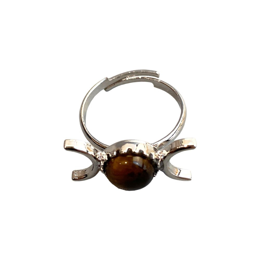 Adjustable ring featuring a 0.5cm gemstone, showcasing its unique design and craftsmanship.