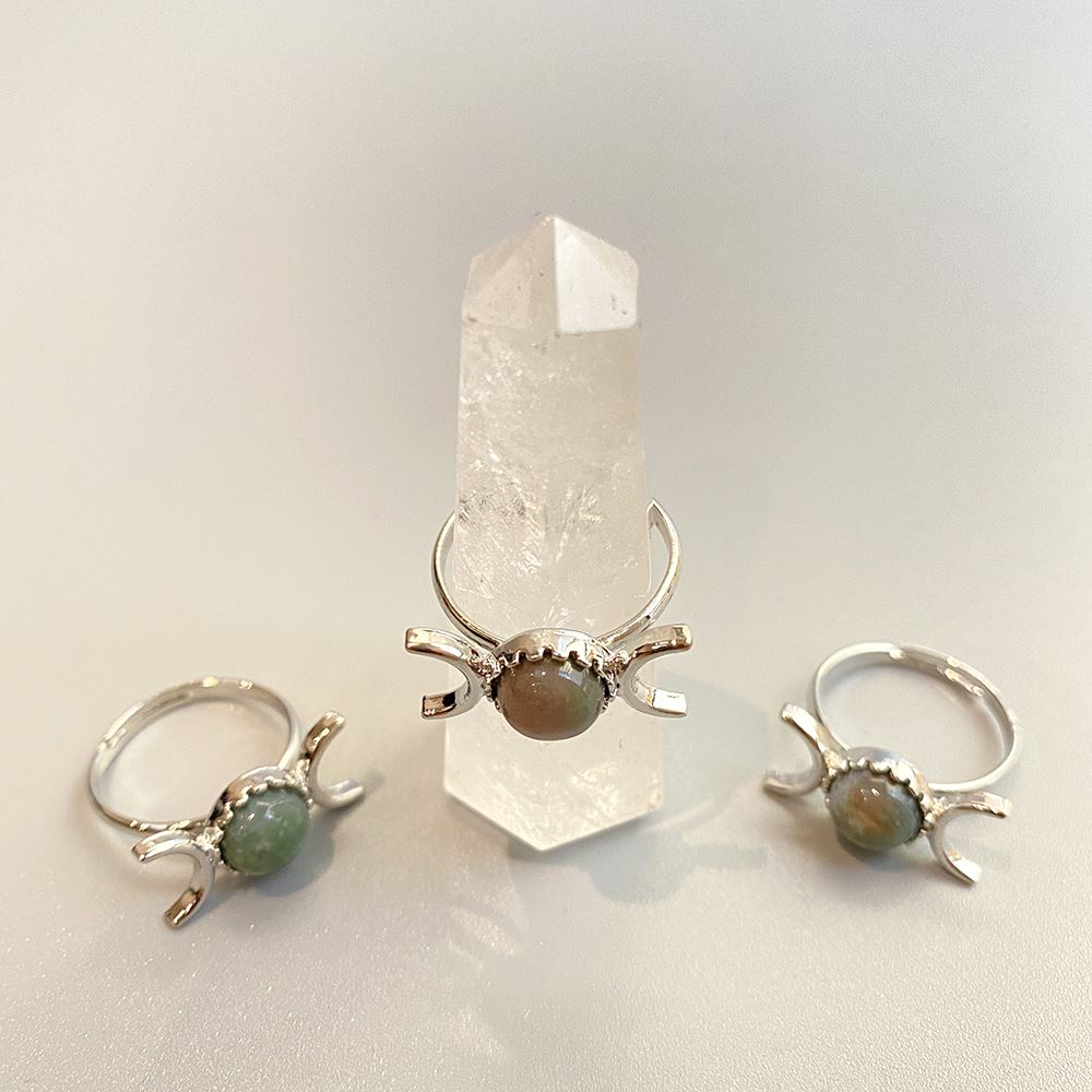 Adjustable ring featuring a 0.5cm gemstone, showcasing its unique design and craftsmanship.