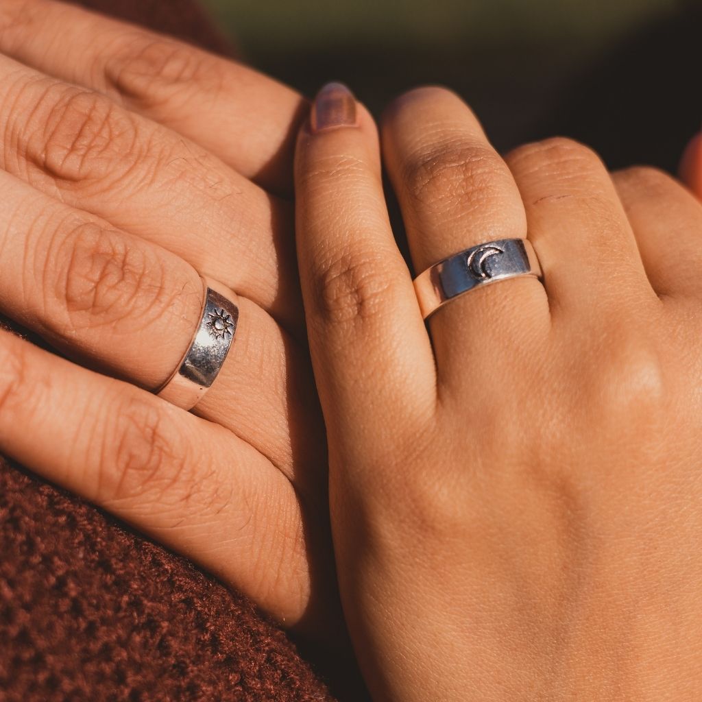 Adjustable silver plated couple promise ring set featuring moon and sun design, symbolizing love and commitment.