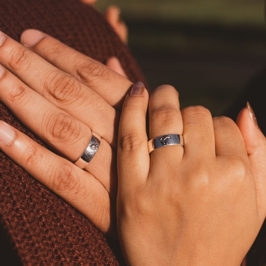 Adjustable silver plated couple promise ring set featuring moon and sun design, symbolizing love and commitment.