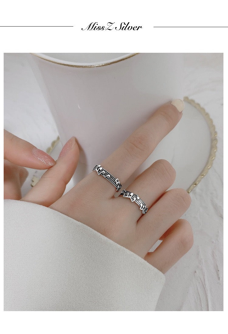 Adjustable Vintage Musical Notes Open Ring made of copper and S925, featuring intricate musical note designs.