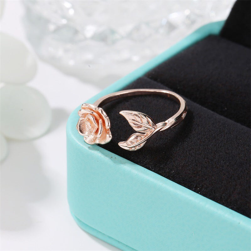 Adjustable vintage rose open ring made of copper with rhinestone embellishments, showcasing a delicate rose design.