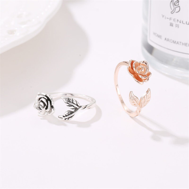 Adjustable vintage rose open ring made of copper with rhinestone embellishments, showcasing a delicate rose design.