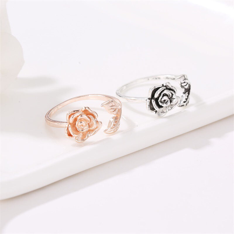 Adjustable vintage rose open ring made of copper with rhinestone embellishments, showcasing a delicate rose design.