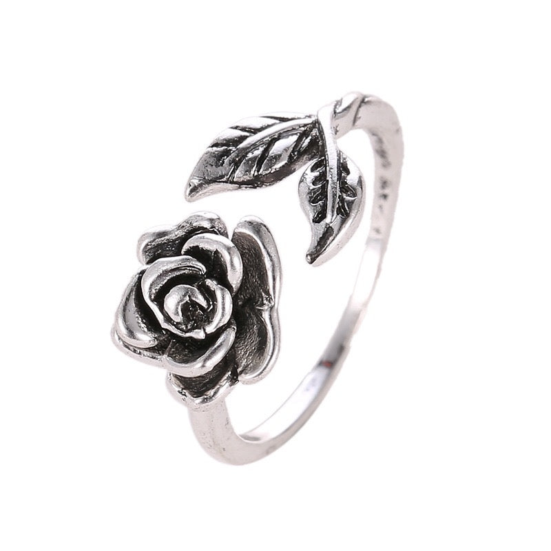 Adjustable vintage rose open ring made of copper with rhinestone embellishments, showcasing a delicate rose design.