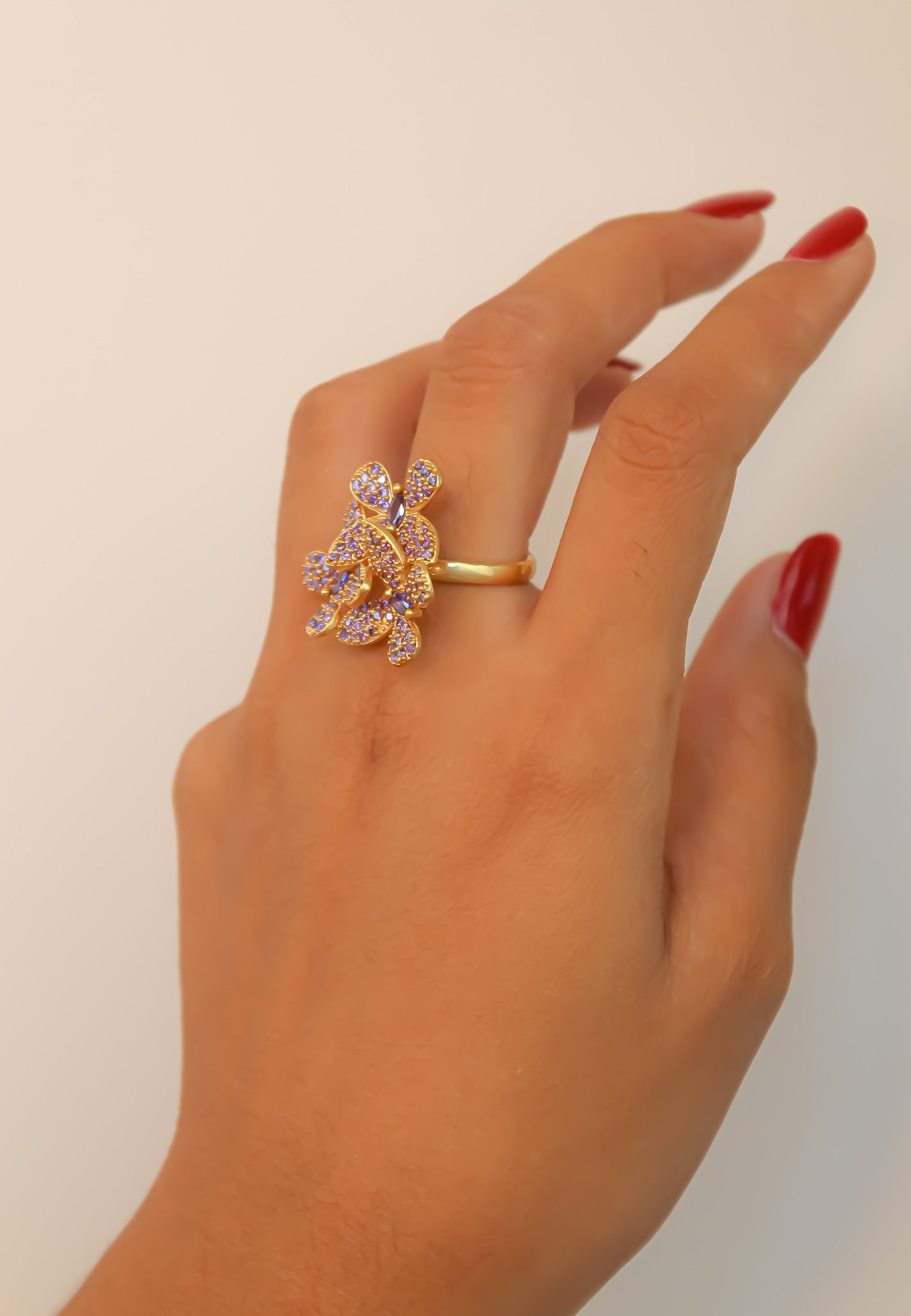 Elegant African Butterfly Ring in 18K gold or silver plating, adorned with sparkling zirconia stones, showcasing a butterfly-inspired design.