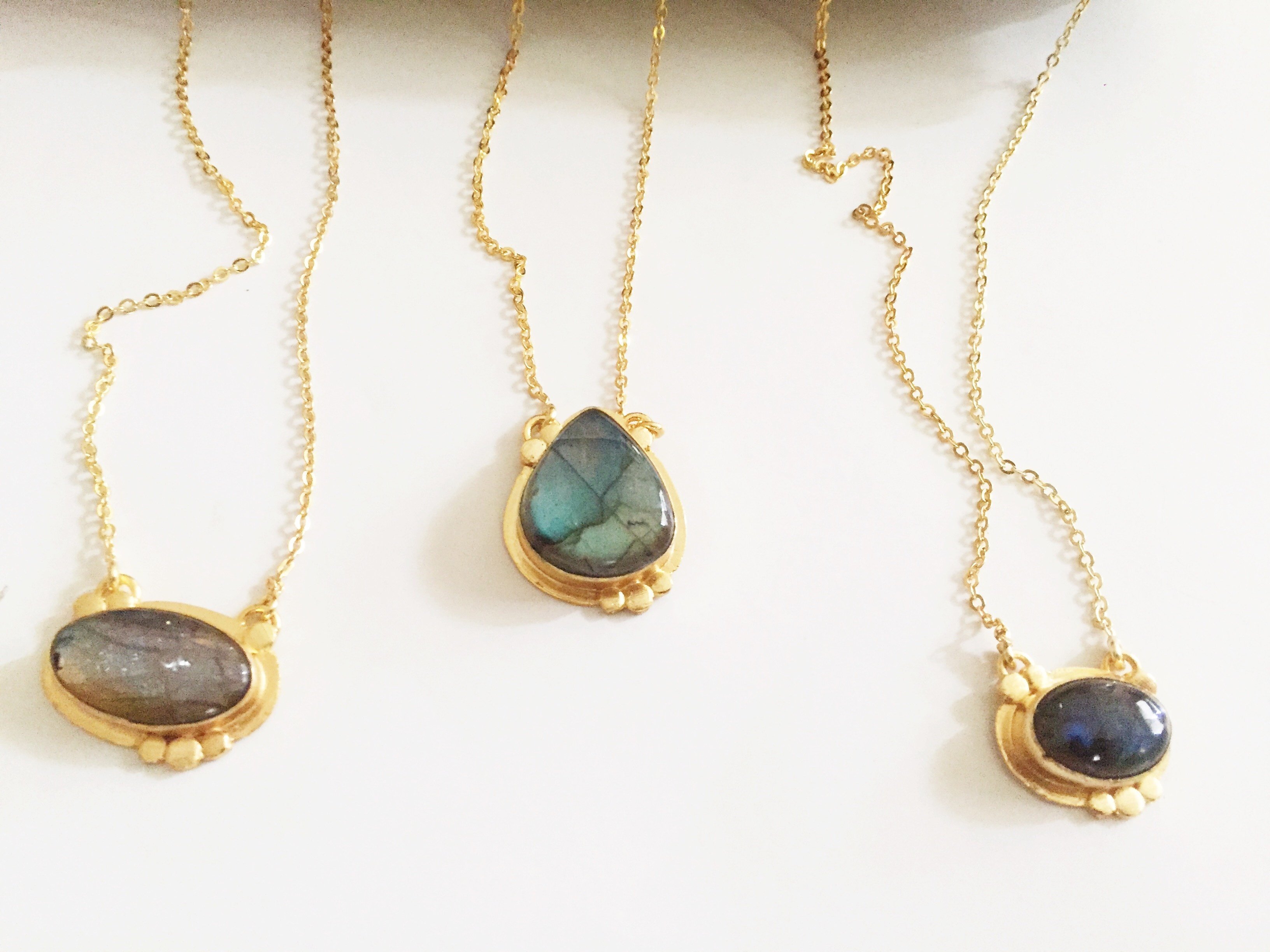 Agadir Labradorite Pendant featuring unique iridescent stone on an 18K gold plated chain.