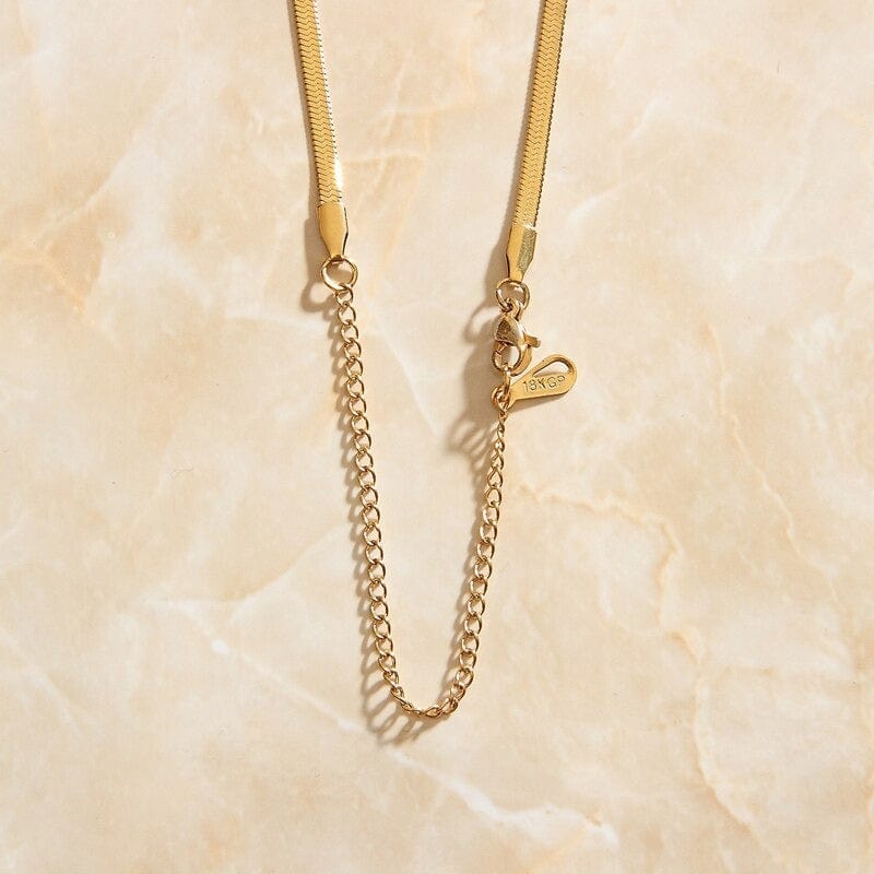 Agapi 3mm Snake Necklace Chain in rich gold, showcasing its elegant design and adjustable length.