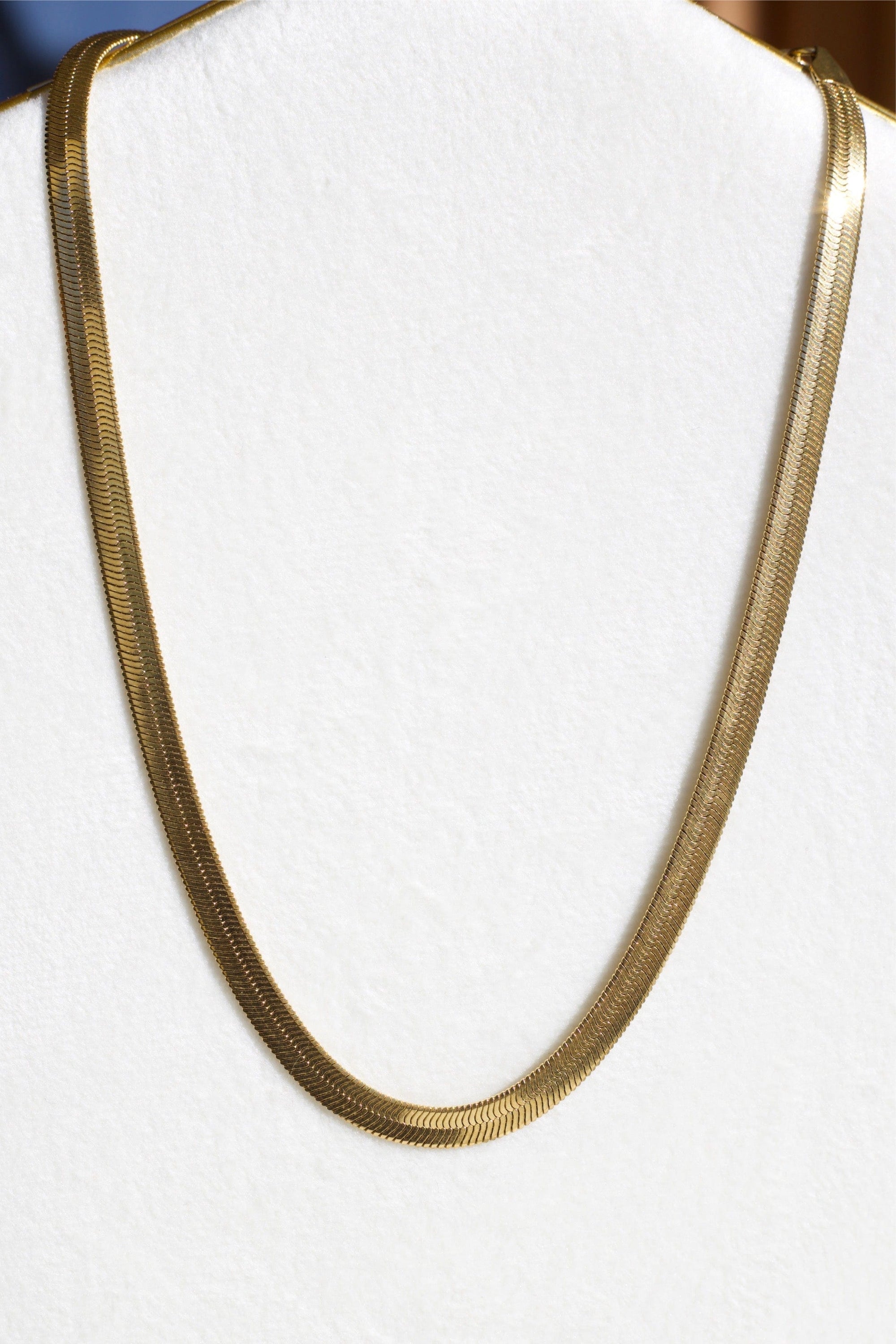 Agapi 5mm Snake Necklace Choker in rich gold, showcasing its elegant design and adjustable length.