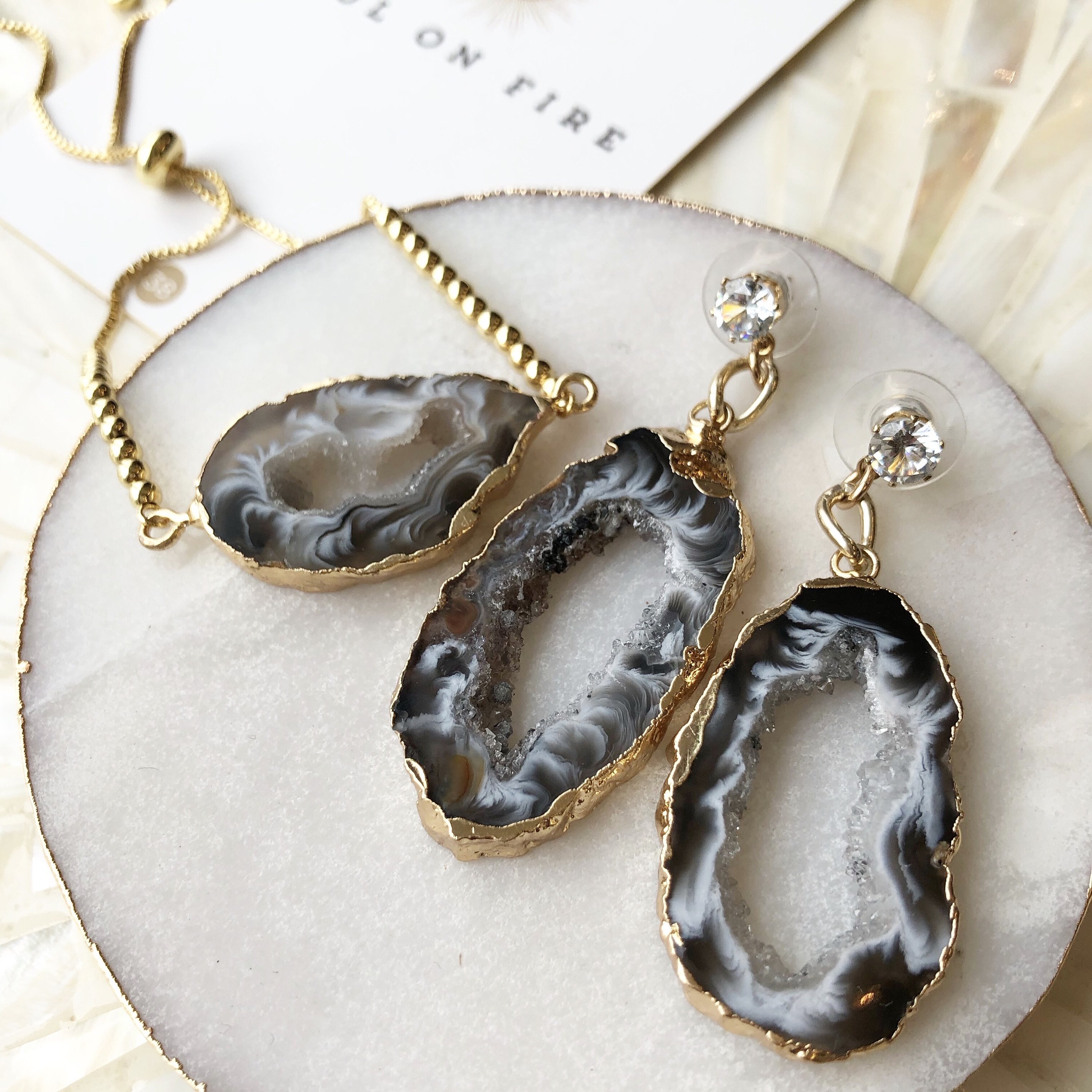 A pair of handmade Agate Slice Cocktail Earrings showcasing unique colors and patterns, perfect for statement jewelry.