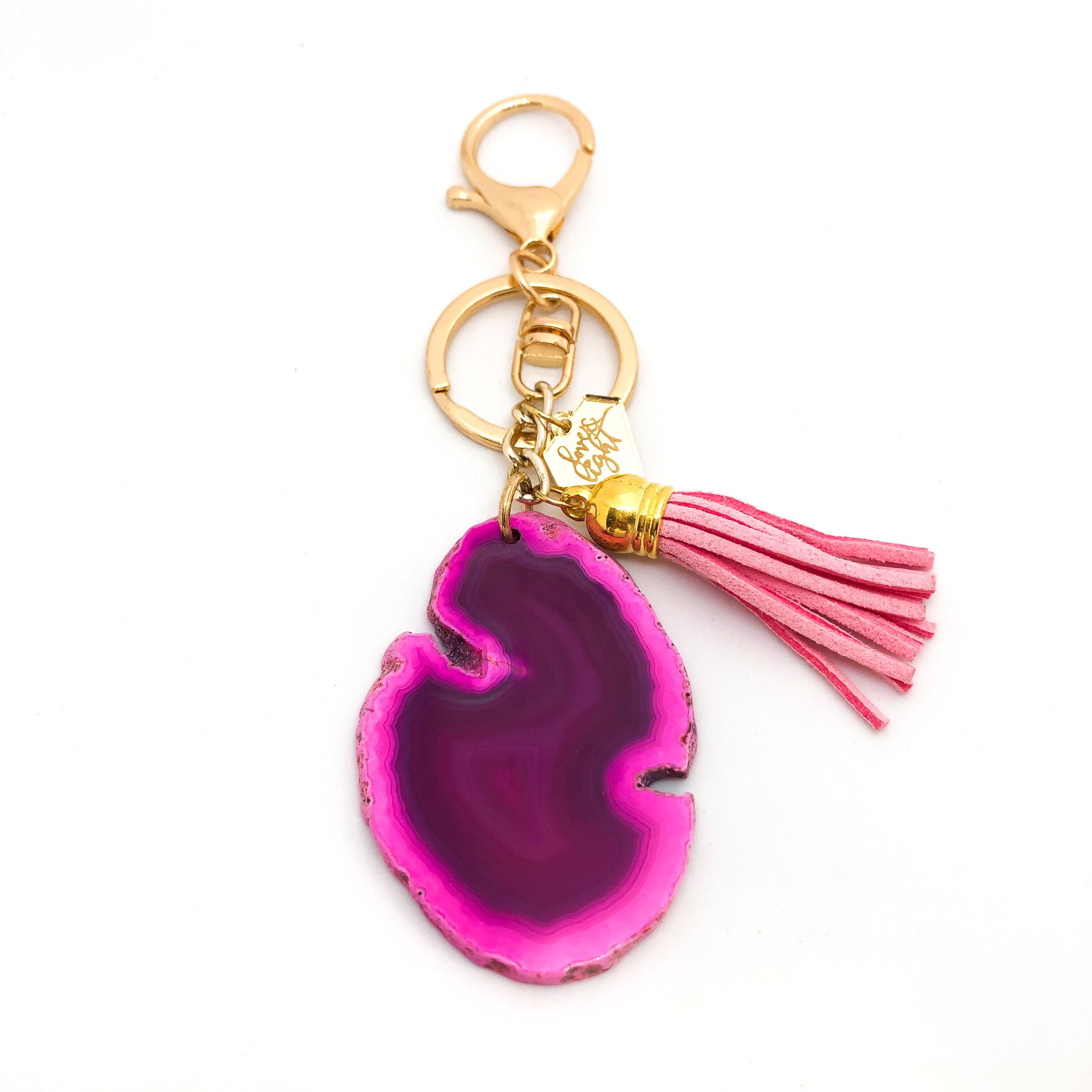 Colorful Agate Slice Keychain with suede tassel and LLJ charm, showcasing unique shapes and vibrant colors.