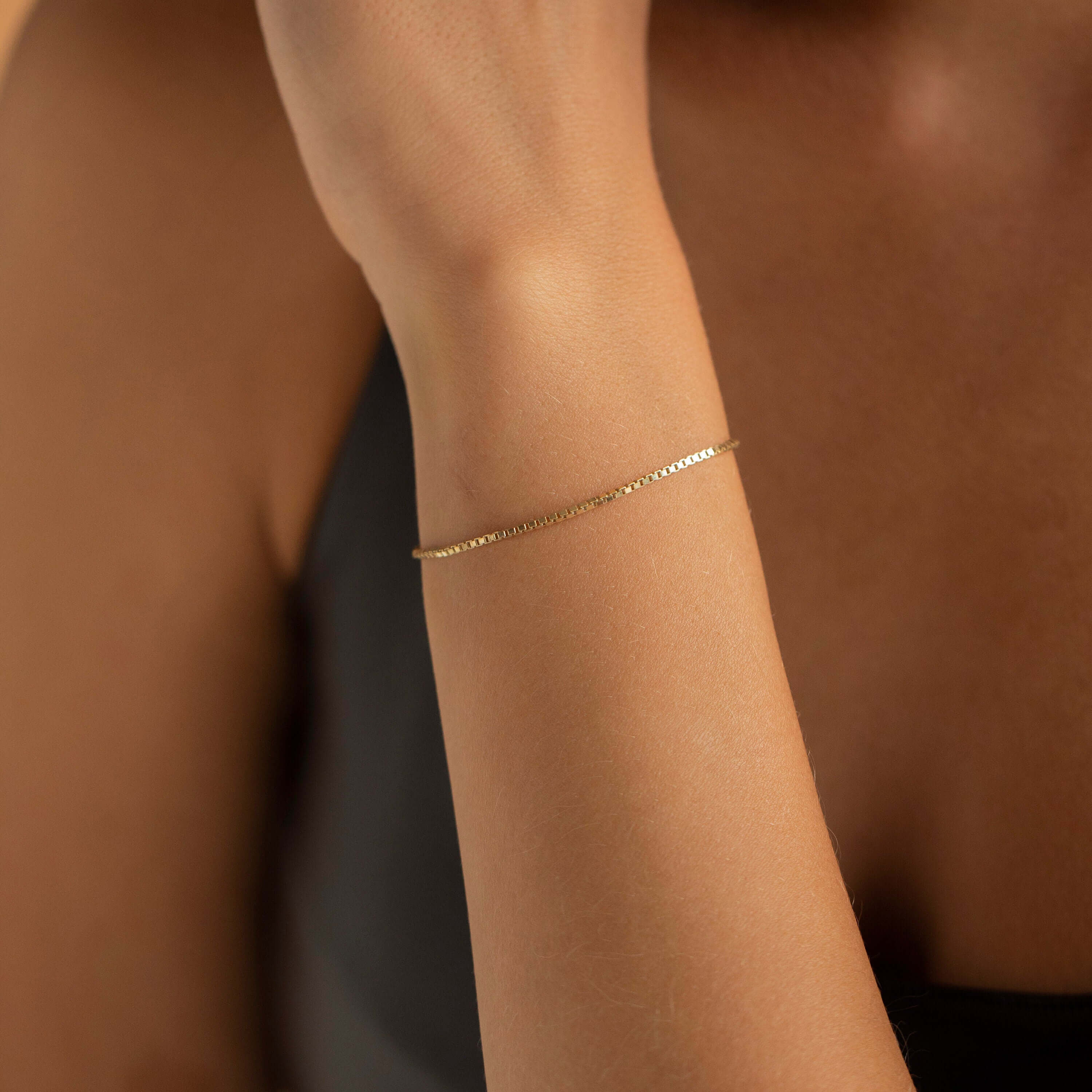 A collection of FARAA's minimalist Arabic bracelets showcasing sleek lines and elegant designs, crafted in Qatar.